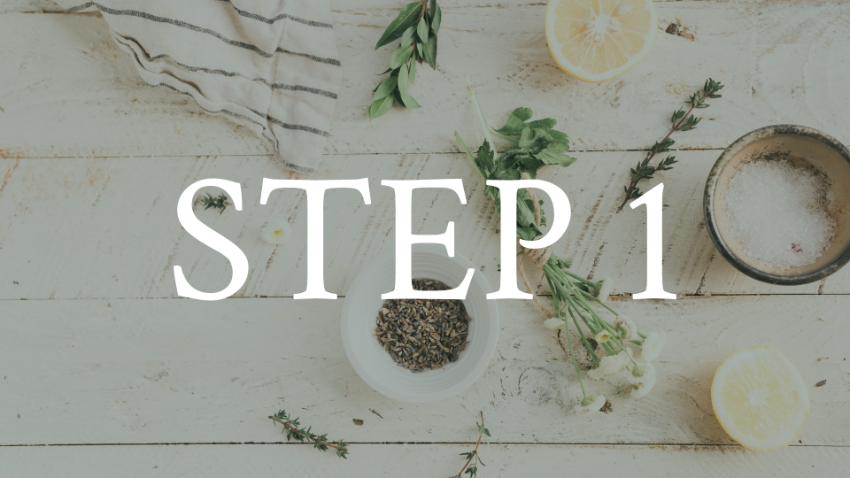 A top-down view of a kitchen table with fresh herbs, a lemon, a bowl of salt, and a small bowl of dried herbs, with text overlay saying 'STEP 1'.