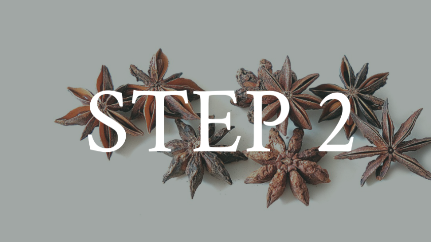 Flat lay of star anise spices on a light gray background with the text "STEP 2" overlaid.