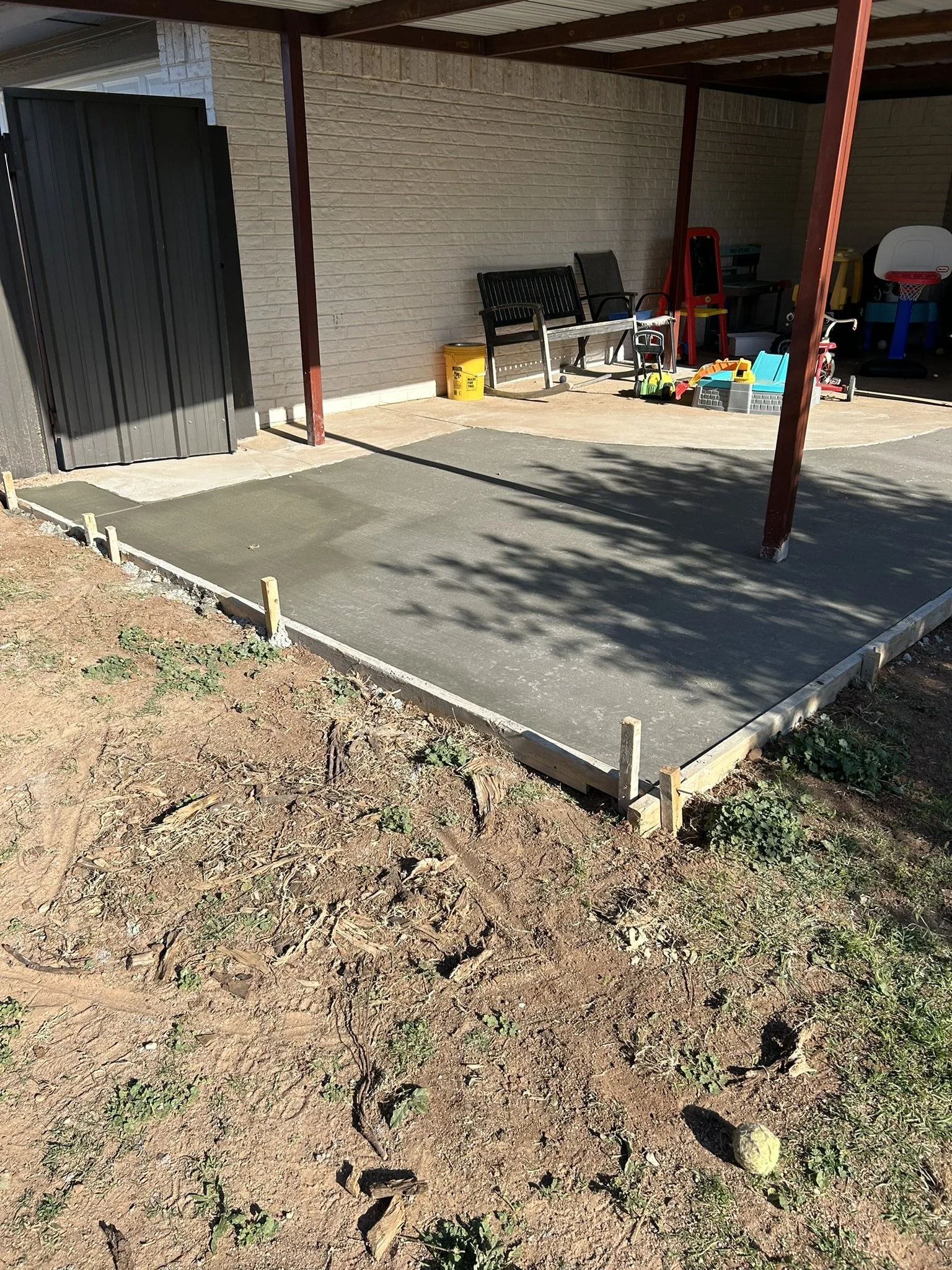 Custom porch extension and concrete flatwork in West Texas.