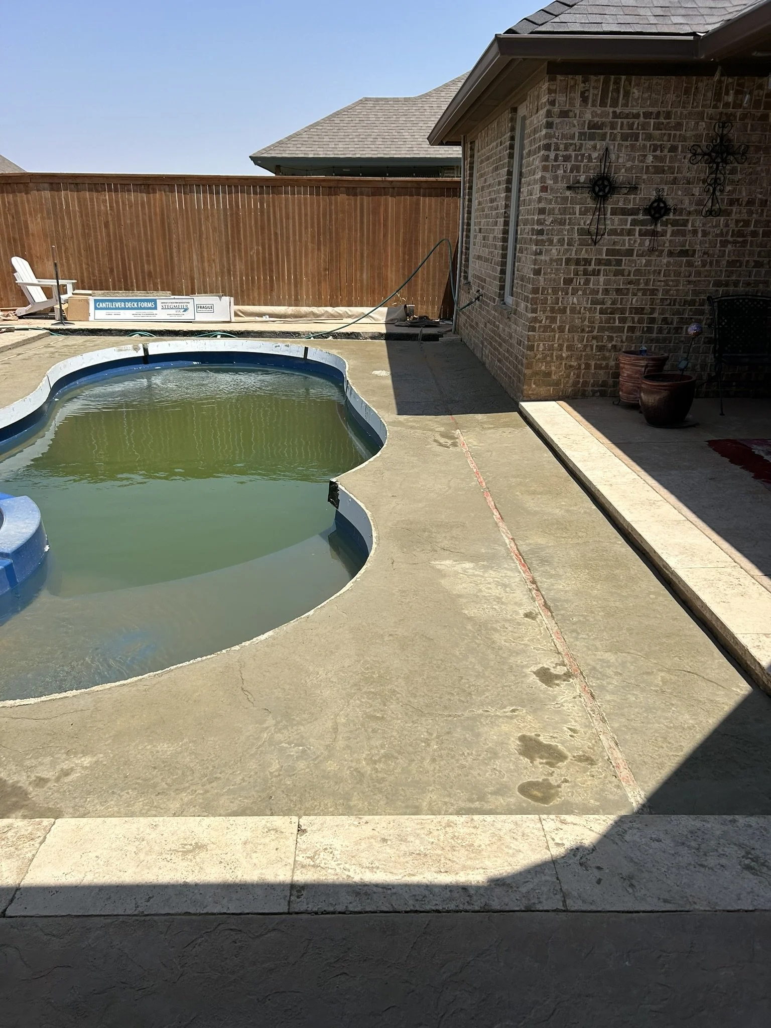 Brushed concrete finishing for slip-resistant pool surround safety.