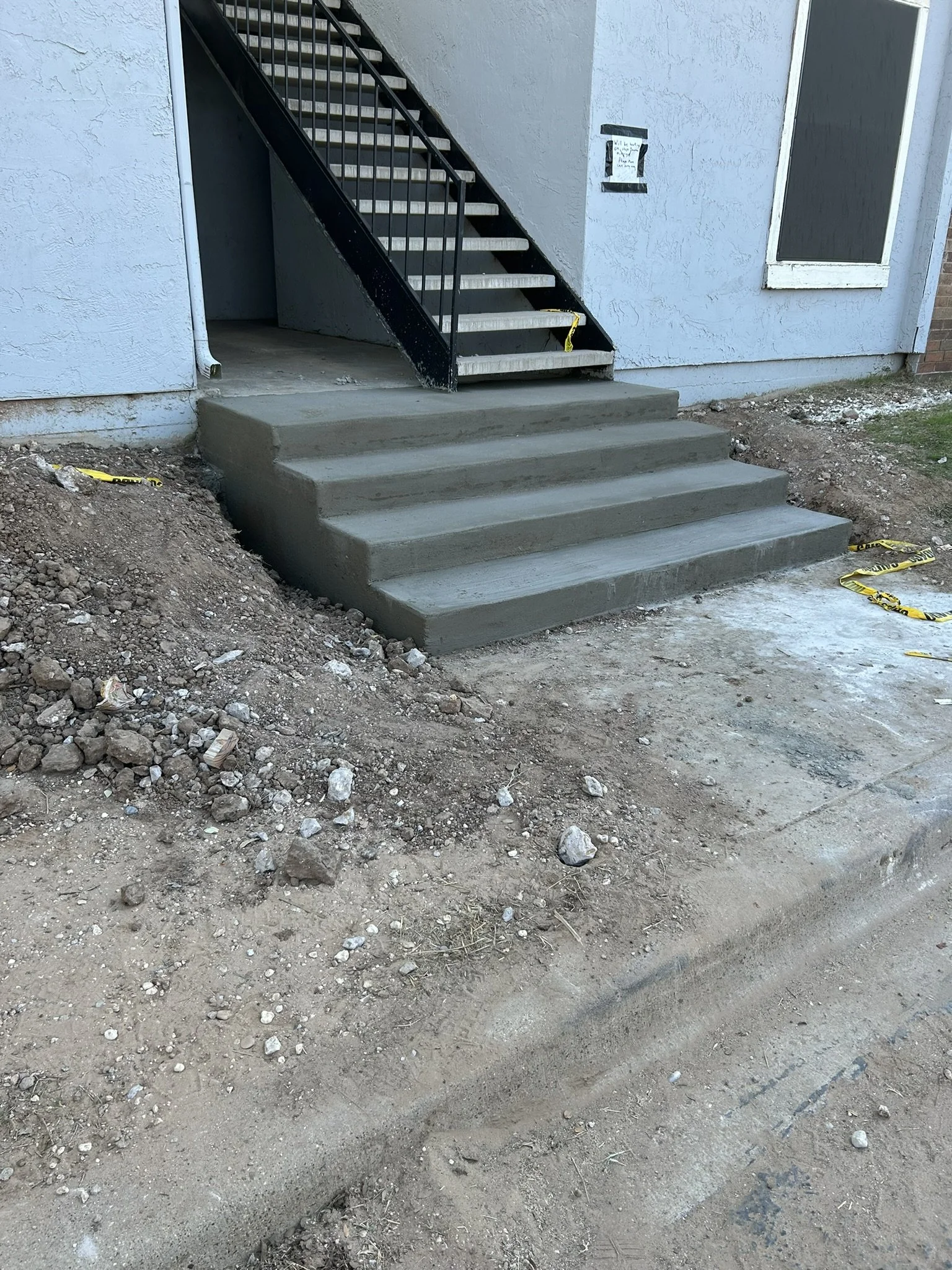Finished concrete stairs and landing built to last in Lubbock.