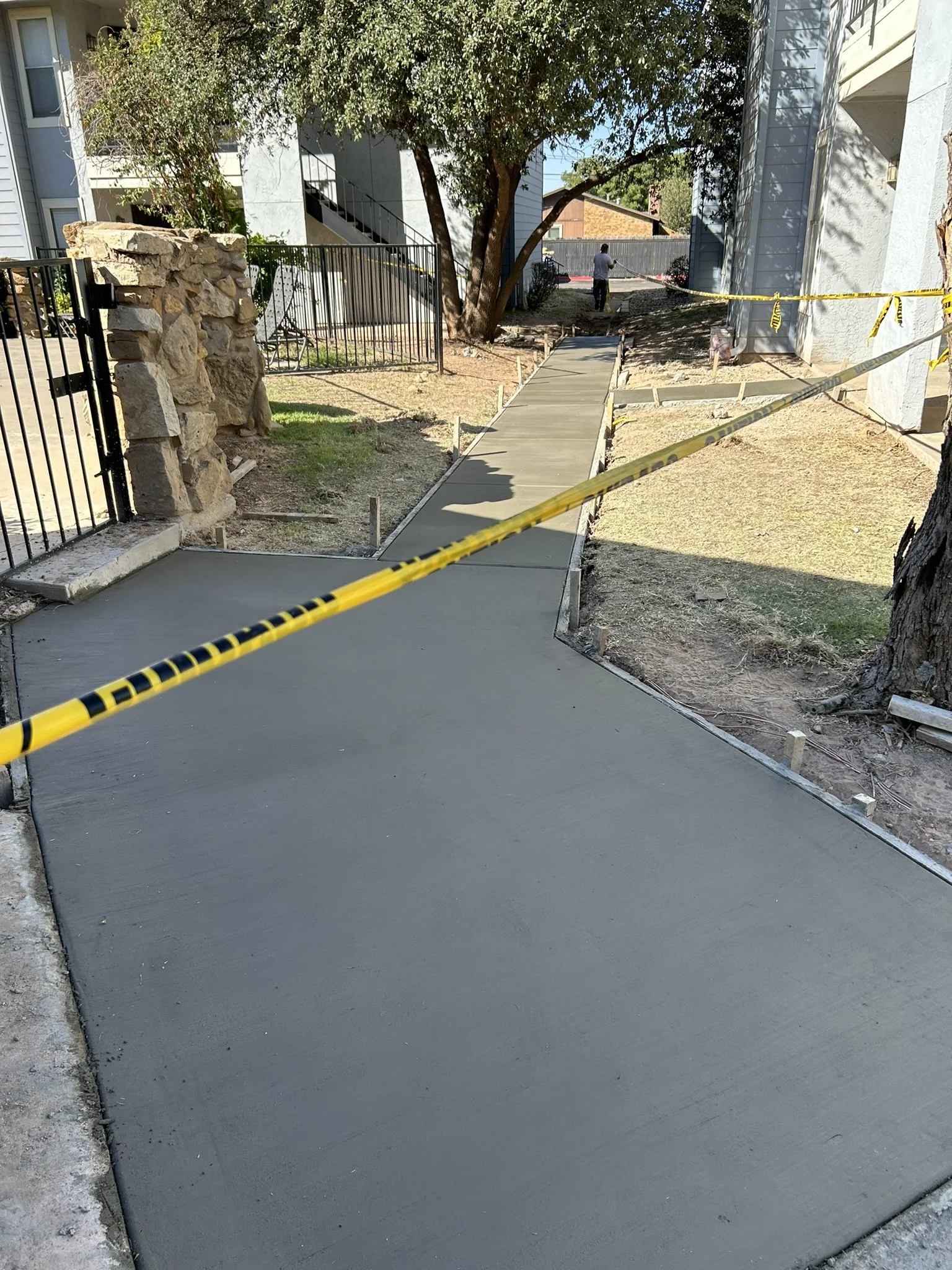 Completed residential concrete pathway installation in Lubbock.