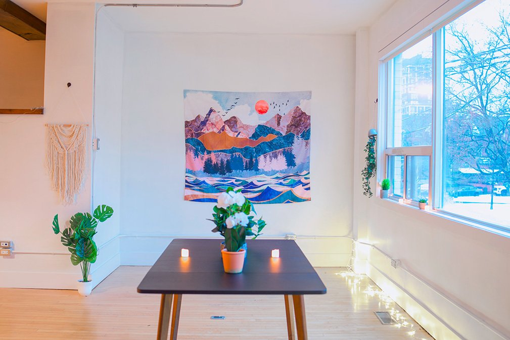 Intimate consultation room at Avir Wellness with natural light and calming decor for private wellness sessions