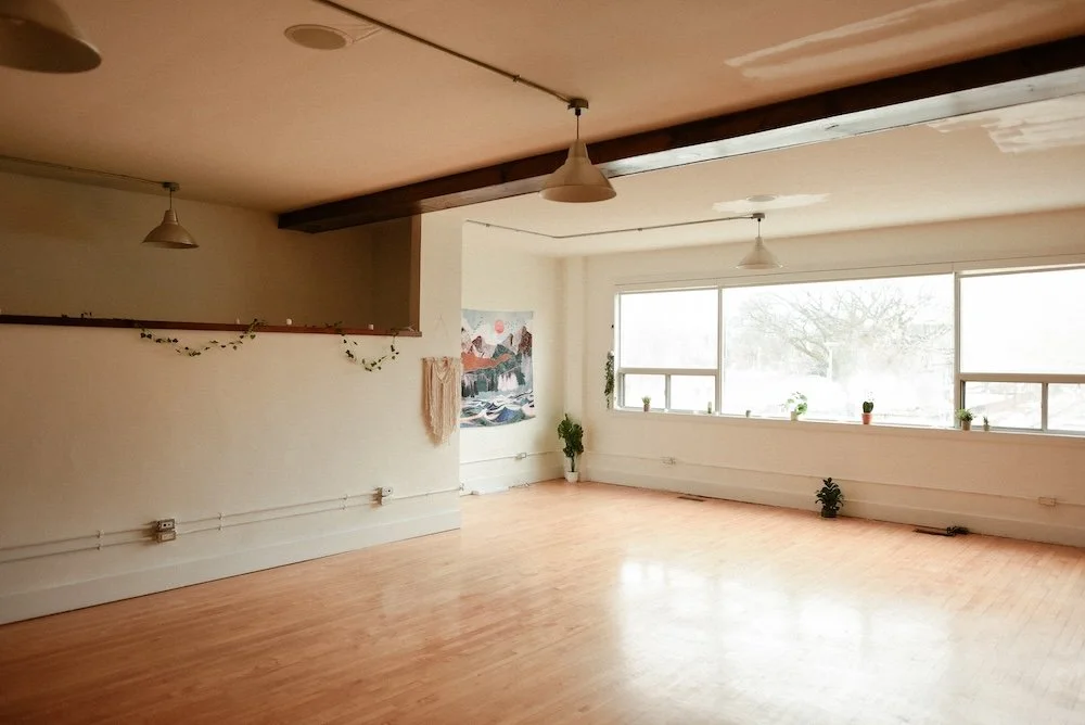 Corner shot of wellness studio over the window and artwork.
