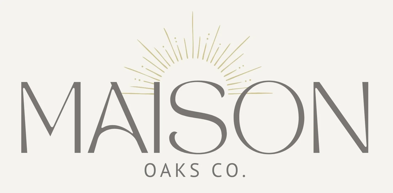 Logo for MAISON OAKS CO., featuring stylized text with a sunburst design behind the word 'MAISON OAKS CO'.