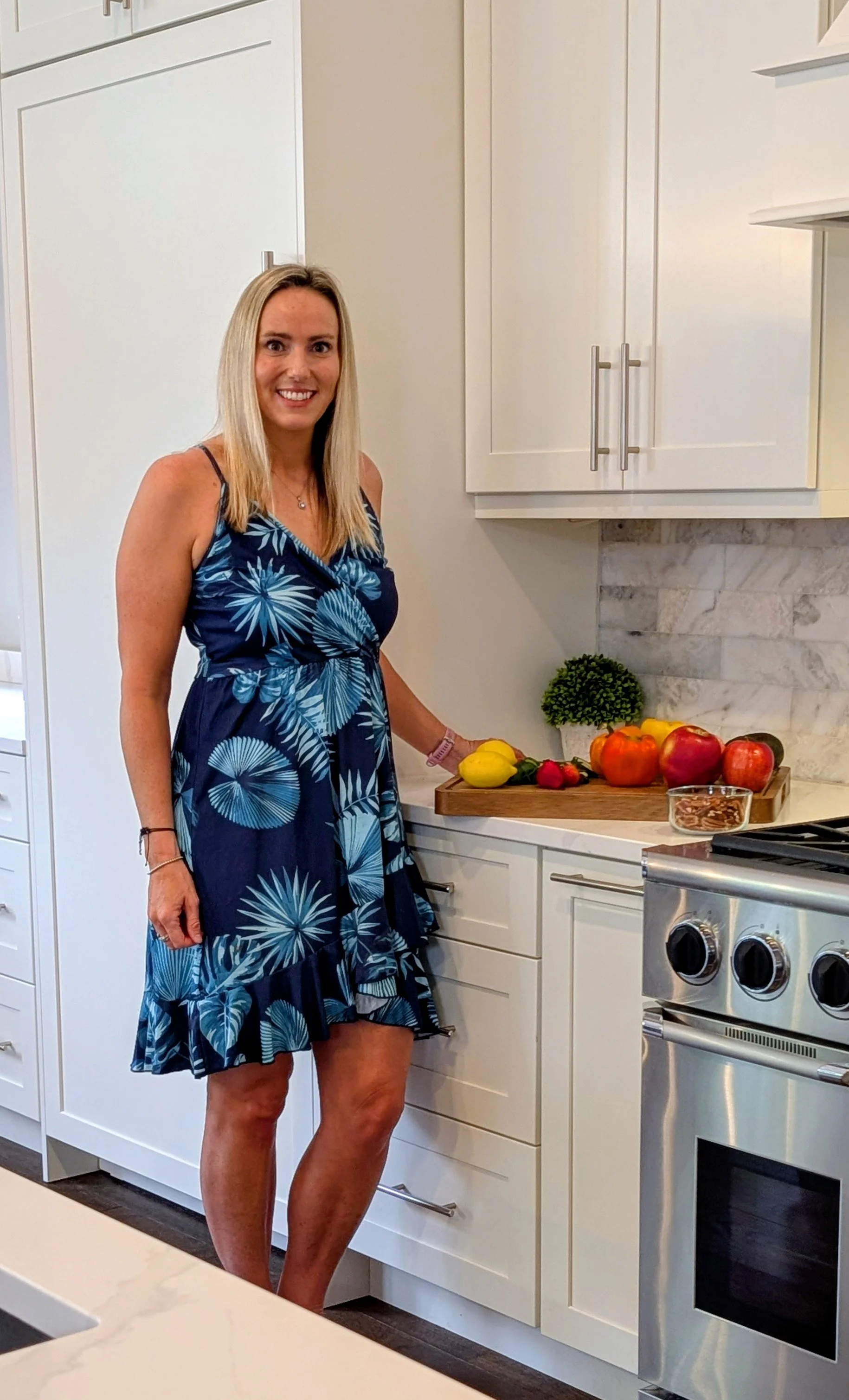 Erin Briley, Functional Nutrition Counselor, standing in the kitchen