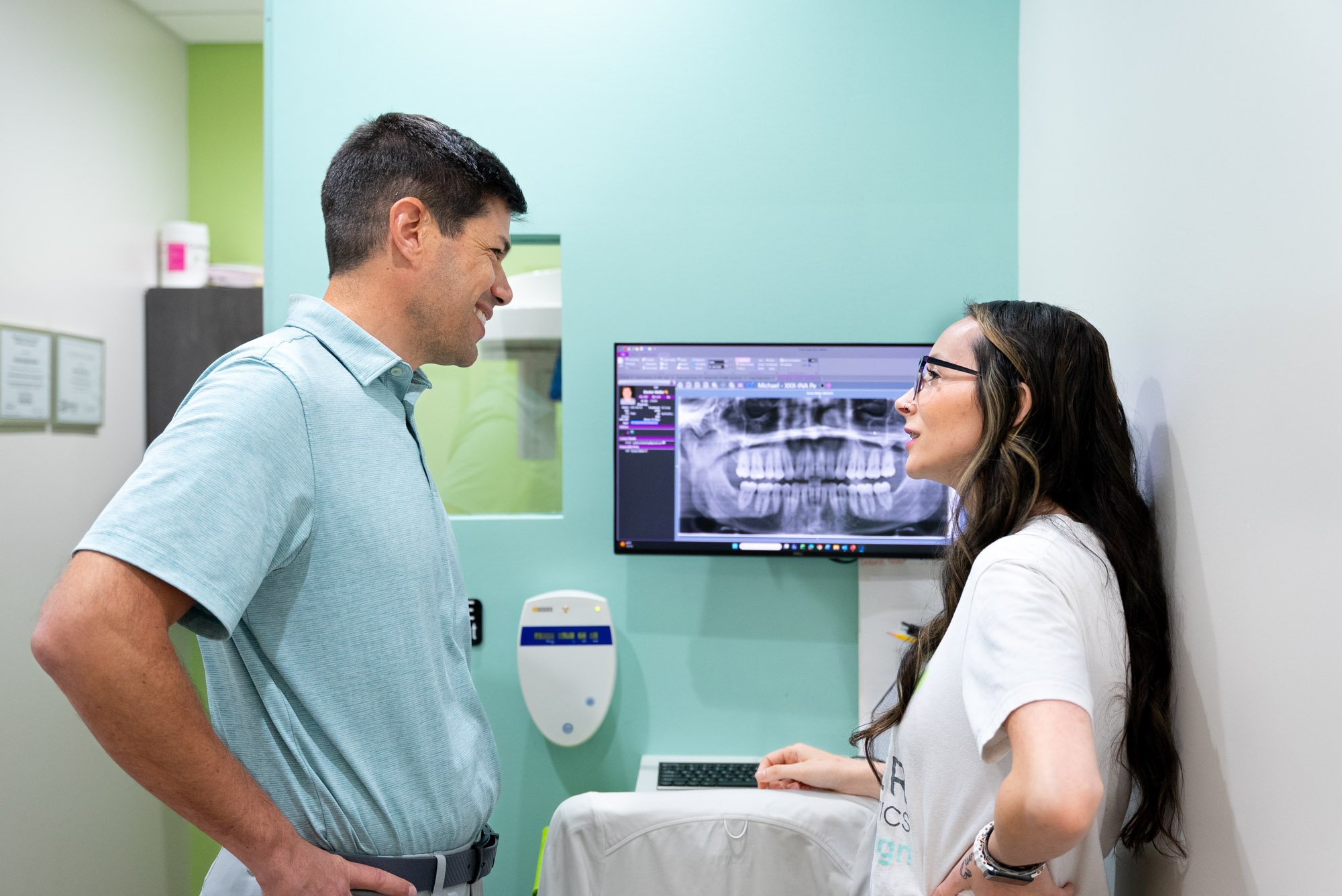 Dr. Weiler and staff reviewing a patient's digital X-ray at Weiler Orthodontics in Harrisonburg, VA