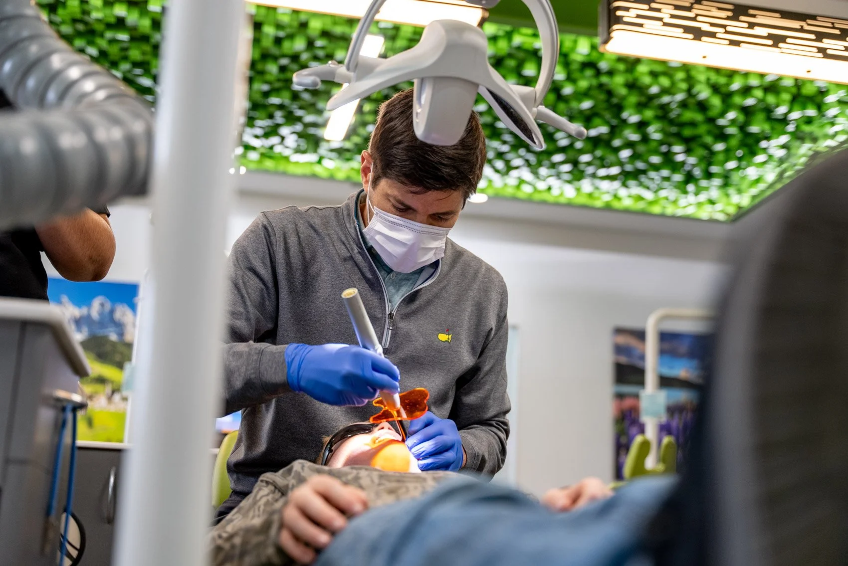 Dr. Weiler examines a patient chairside during a fall orthodontic visit at his Harrisonburg, VA practice