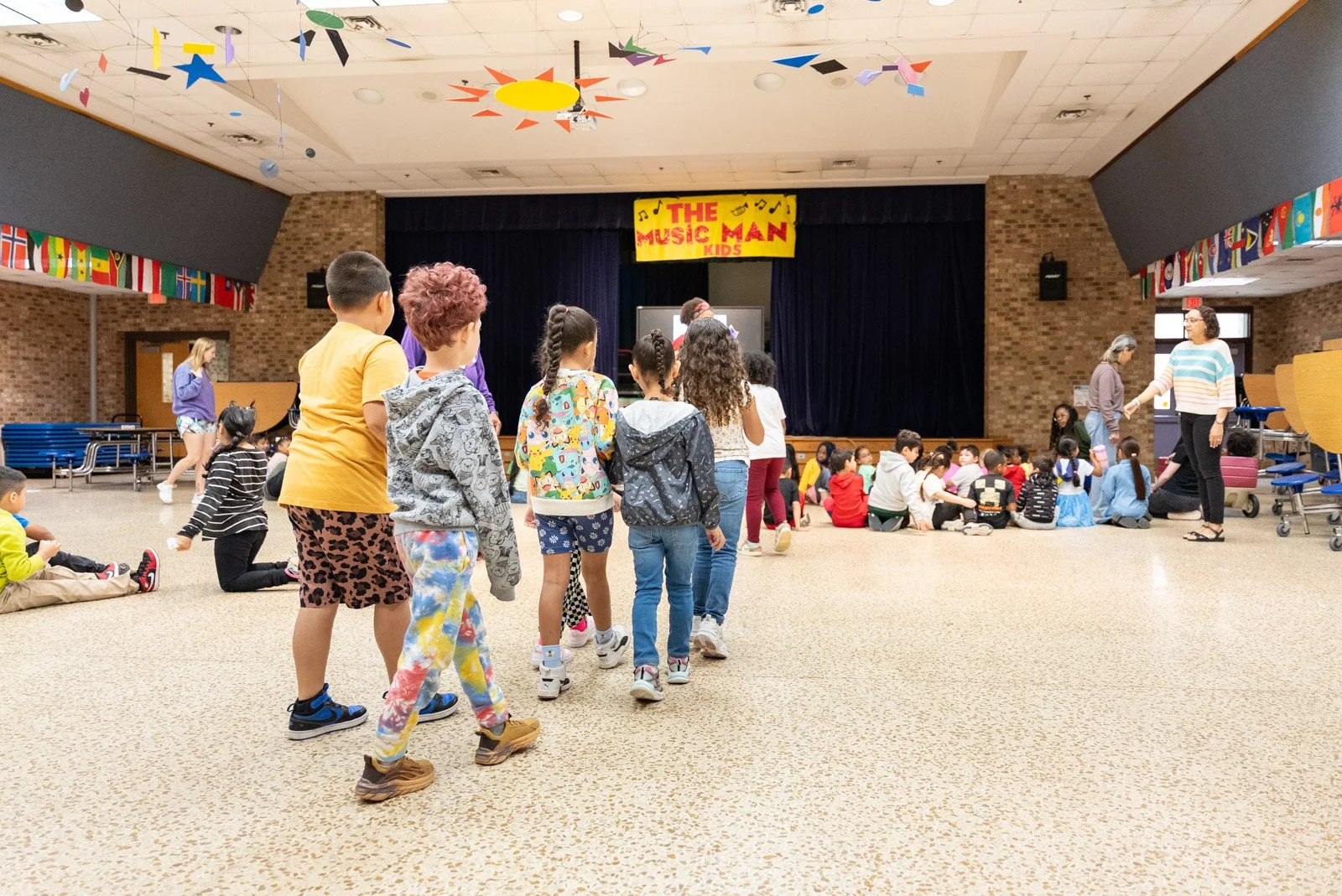 Students head into a school assembly as Harrisonburg, VA families settle into fall routines with braces and Invisalign treatment