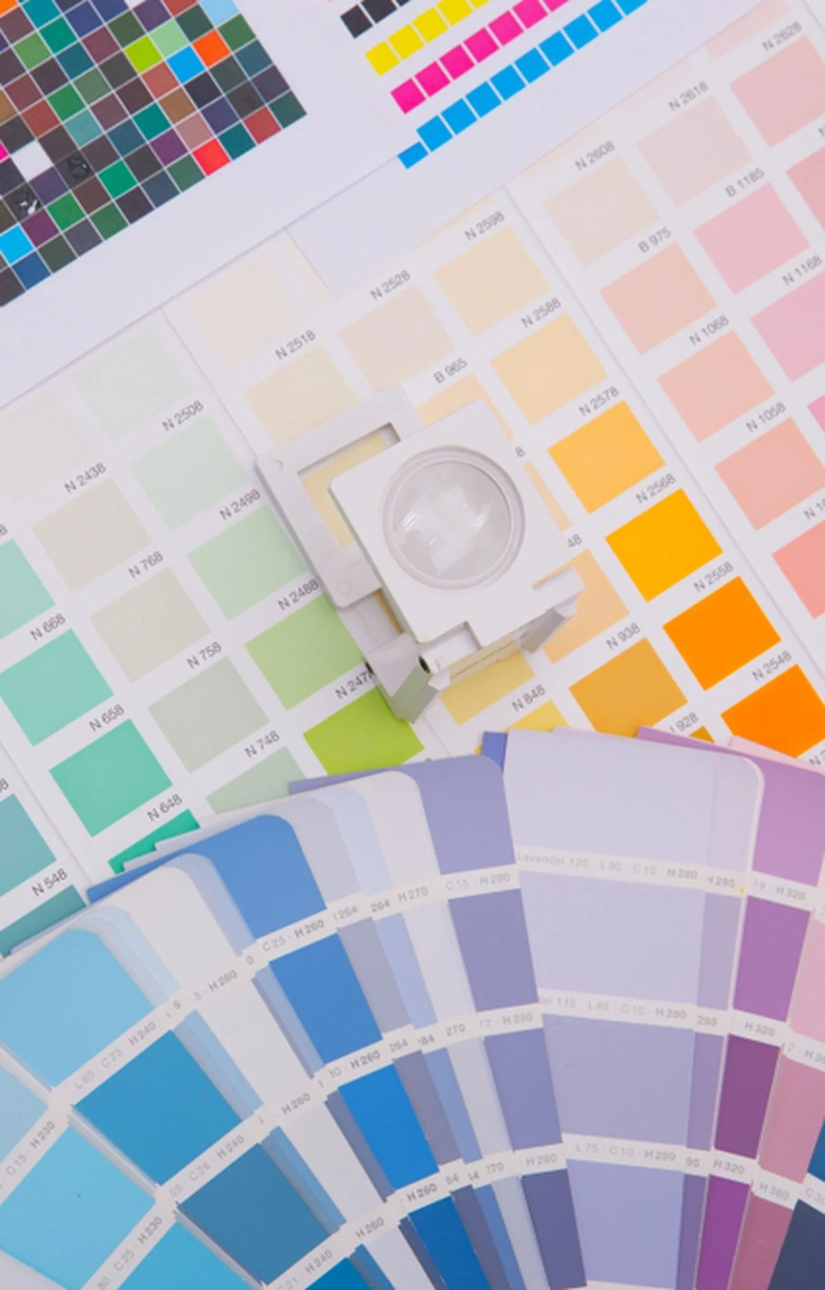 Ink swatch charts, CMYK color patches and a print loupe