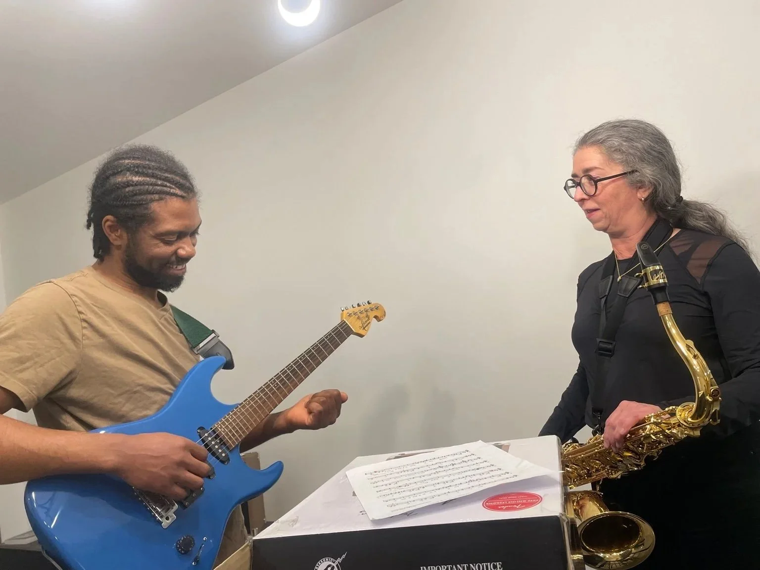 Madagasy musician rehearing with Canadian guitarist in saint Antoint abbey in Quebec