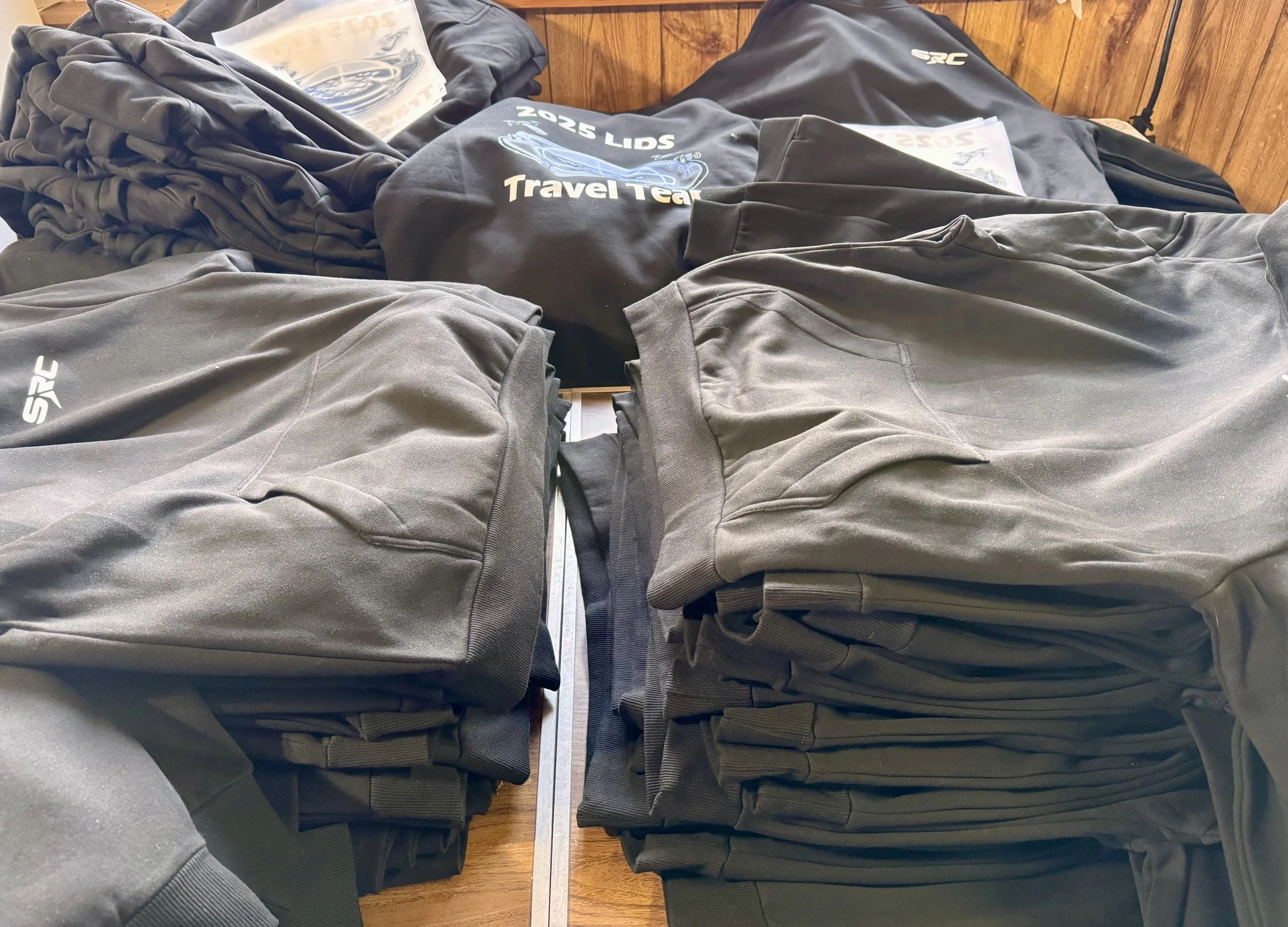 Bulk custom apparel order with embroidered and printed sweatshirts for a Central New York technology organization