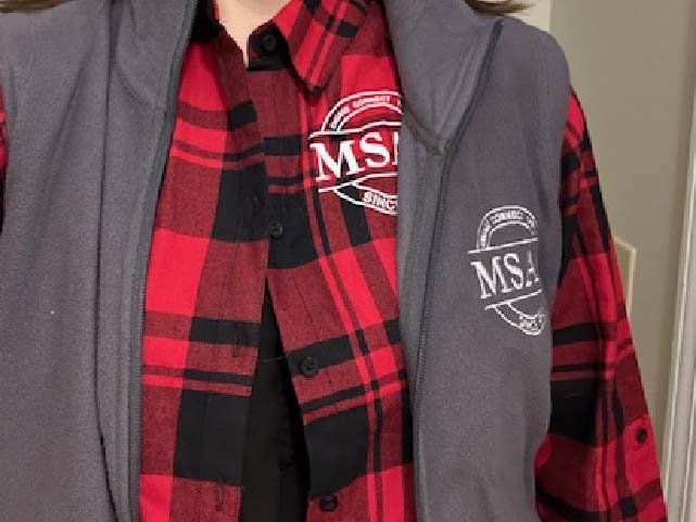 Image of local senior center logo. DTF on bottom shirt, embroidered on vest