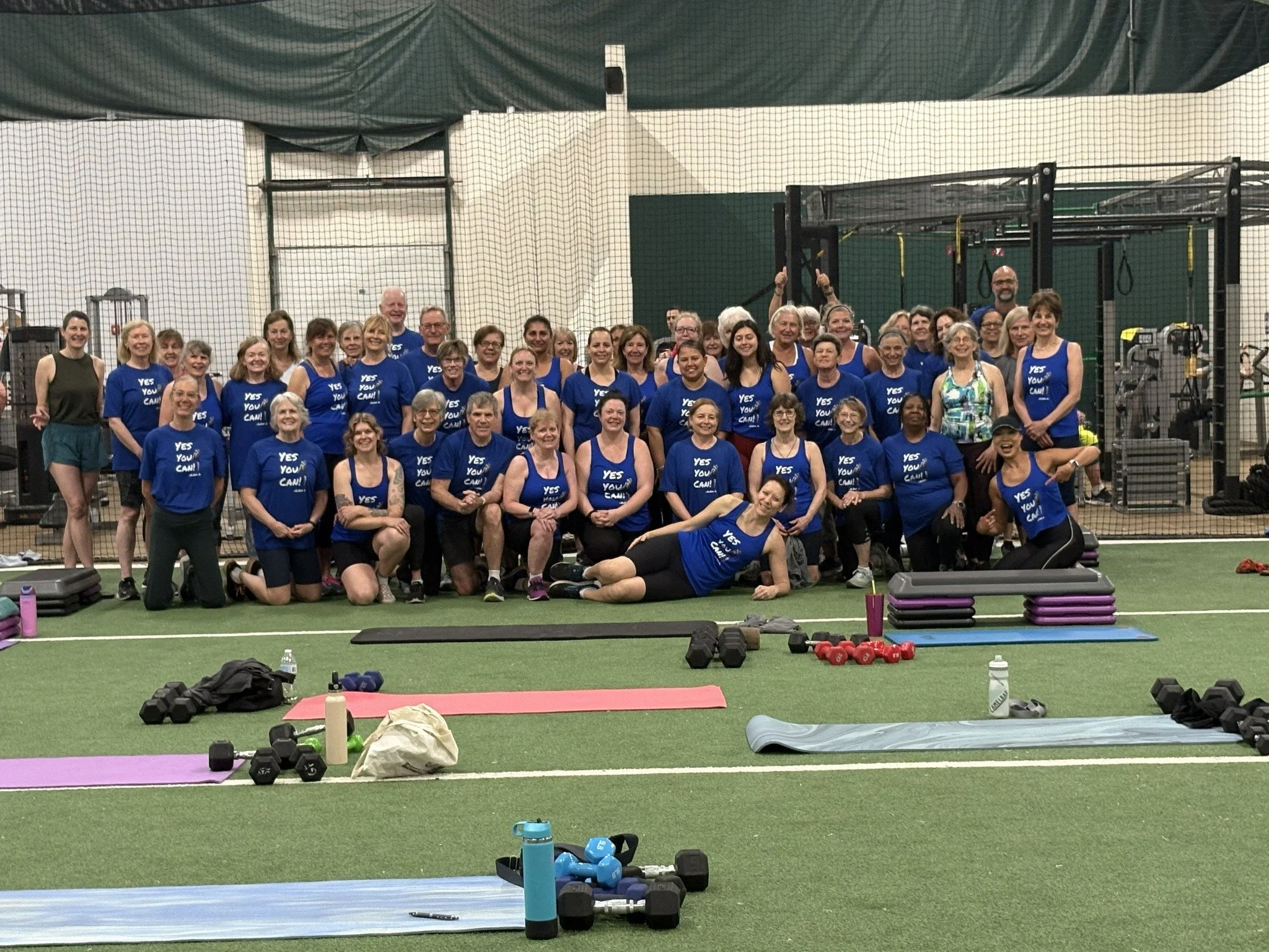 Large exercise class group with matching shirts