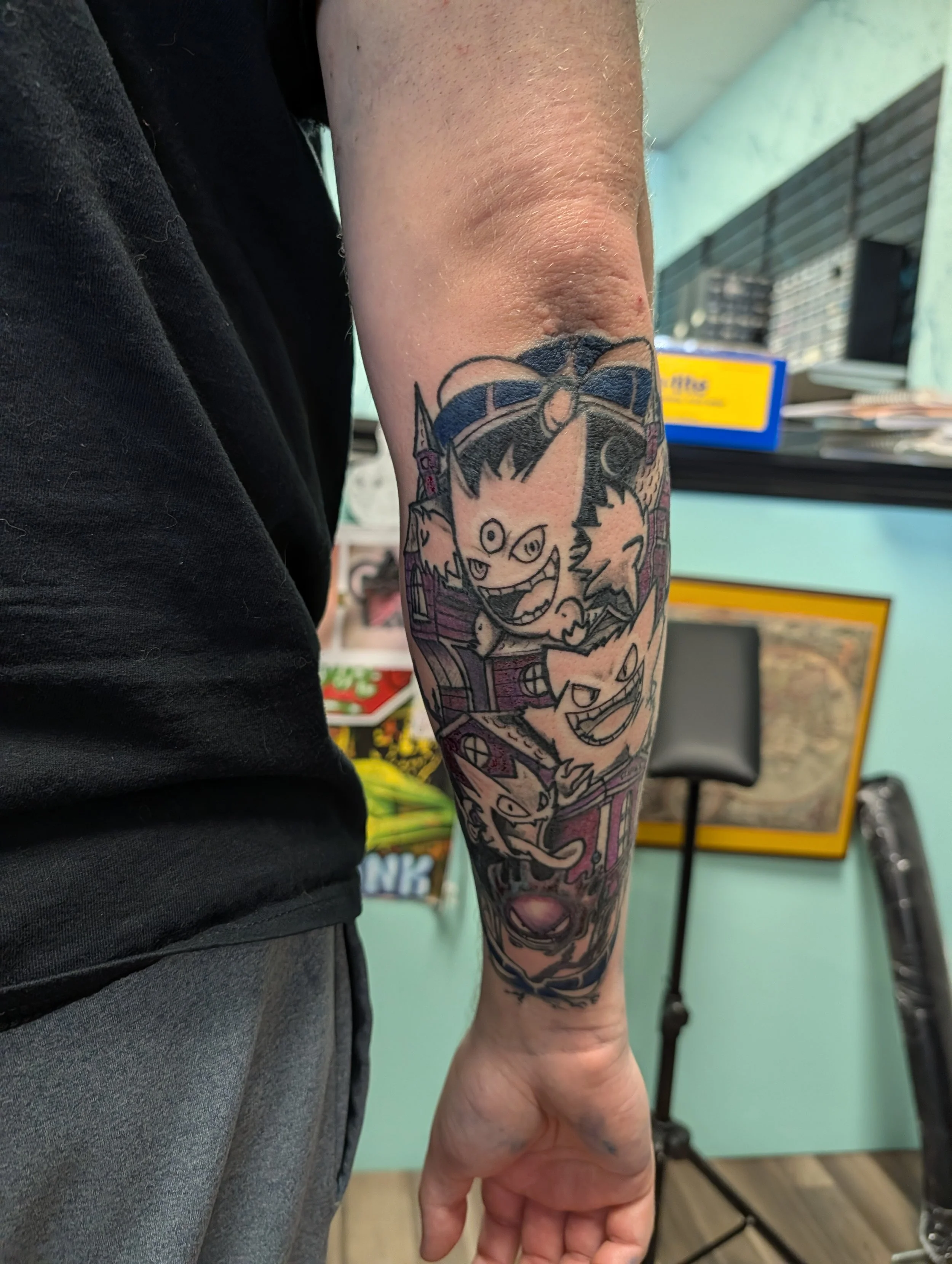 pokemon tattoo on the forearm of the gengar ghastly and haunter evolution line.