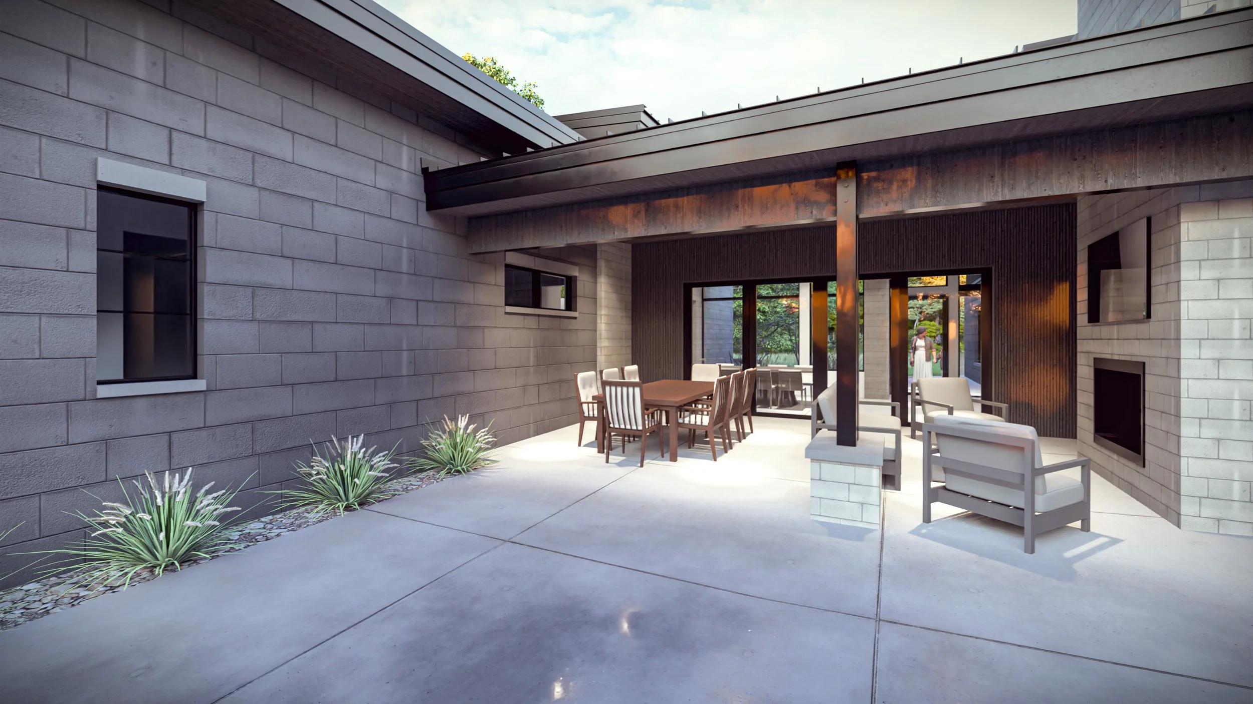 Modern home outdoor living area designed for entertaining, with covered patio space and seamless connection to the interior