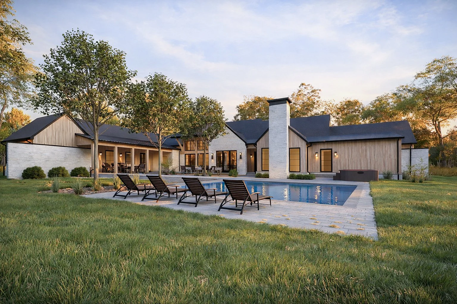 luxury backyard estate featuring a custom linear swimming pool, a stone patio, and a manicured green lawn.