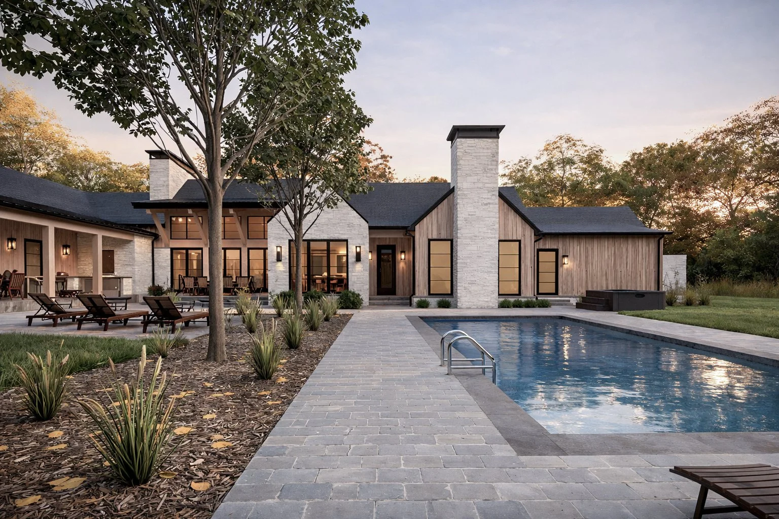 Luxury outdoor entertainment pavilion and backyard estate illuminated beautifully by warm exterior lighting