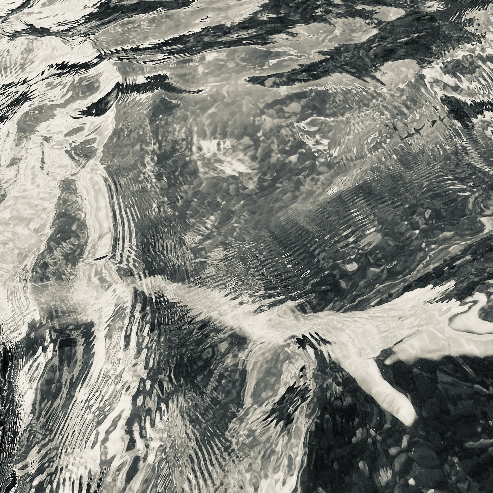 Captain e2 Brewster in the water — ripples and reflections across the surface, part of this series.