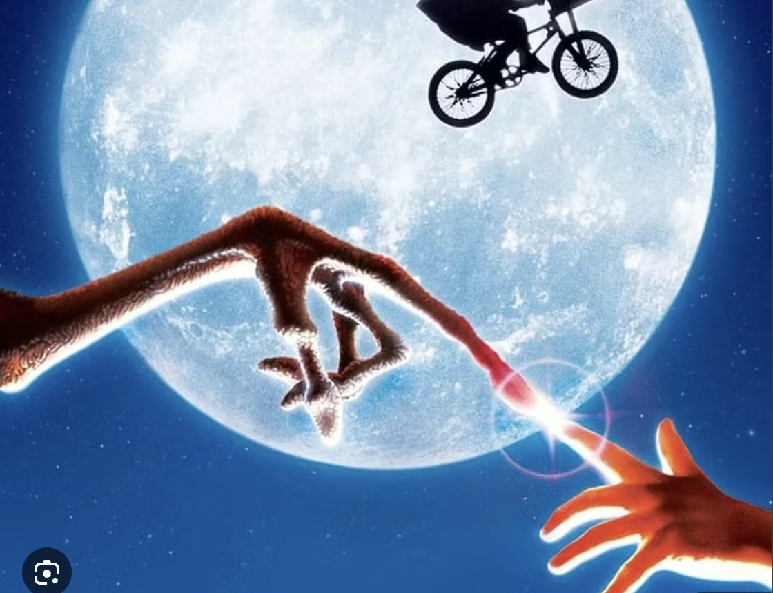 A surreal digital illustration showing a hand reaching out to touch a finger of a creature with a long, fur-covered arm against a backdrop of a large, glowing moon. A silhouette of a person on a bicycle is visible near the moon in space. The scene is fantasy and science fiction themed.