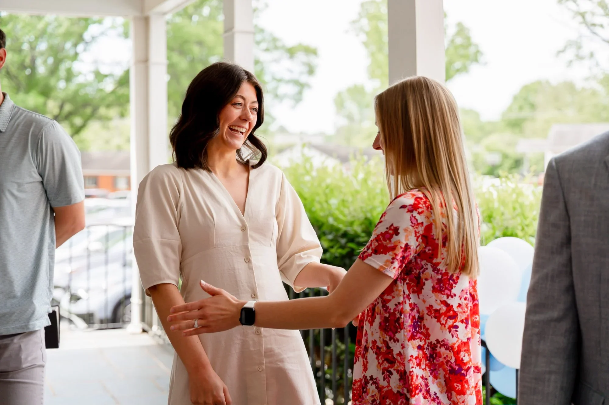 two women greeting at Sunday service