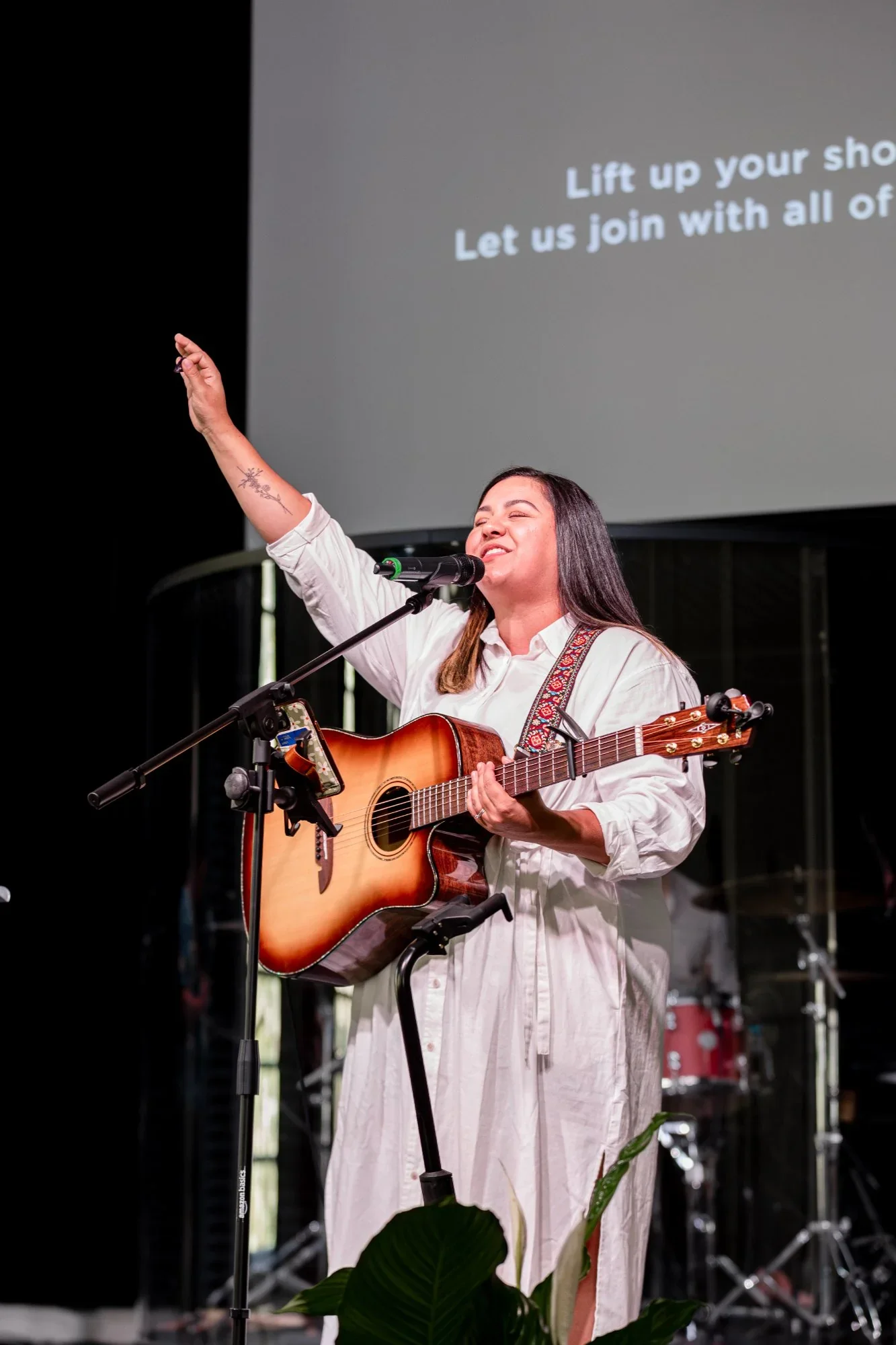 guitarist singing and worshipping
