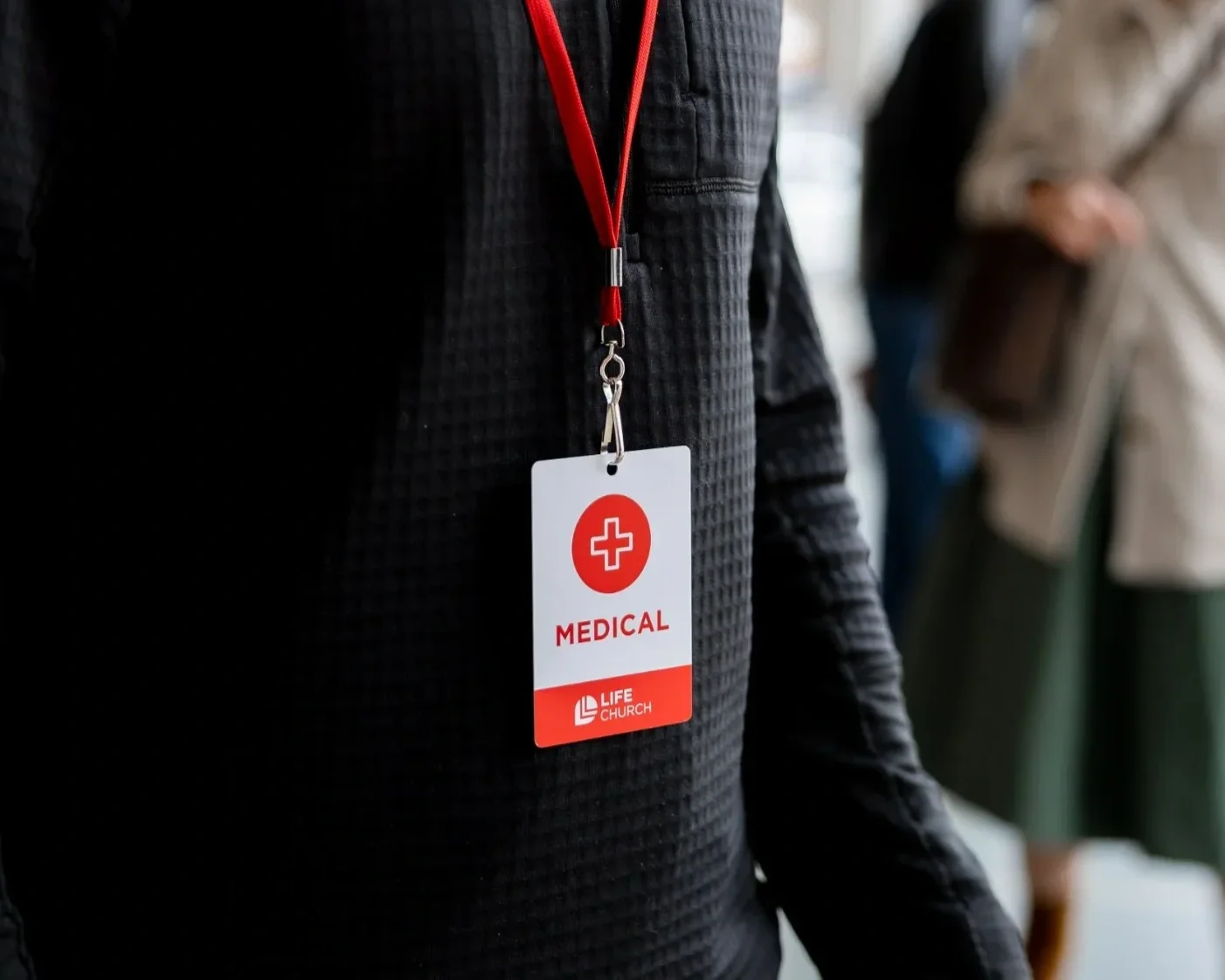 badge identifying medically trained volunteers