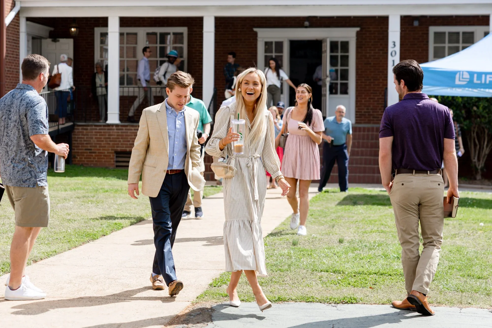 church attendees leaving Sunday service, entrance in the background