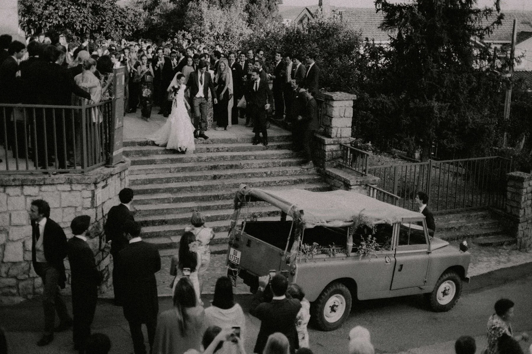 Bride and groom exits ceremony after wedding in Spain, cinematic capture photographed by lookimaginary