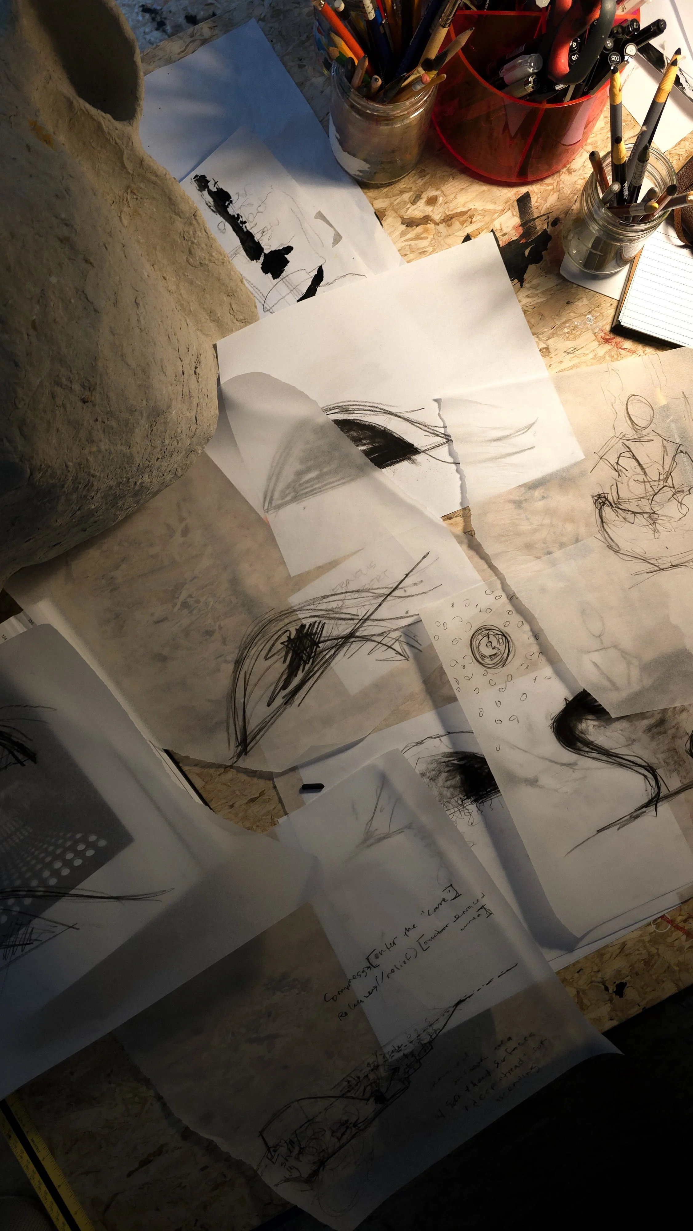 Caroline Wallace’s studio workspace with active sketches and material experiments — reflecting the layered, sensory nature of her practice. Pencils, pens, architectural design drawing and art tools.