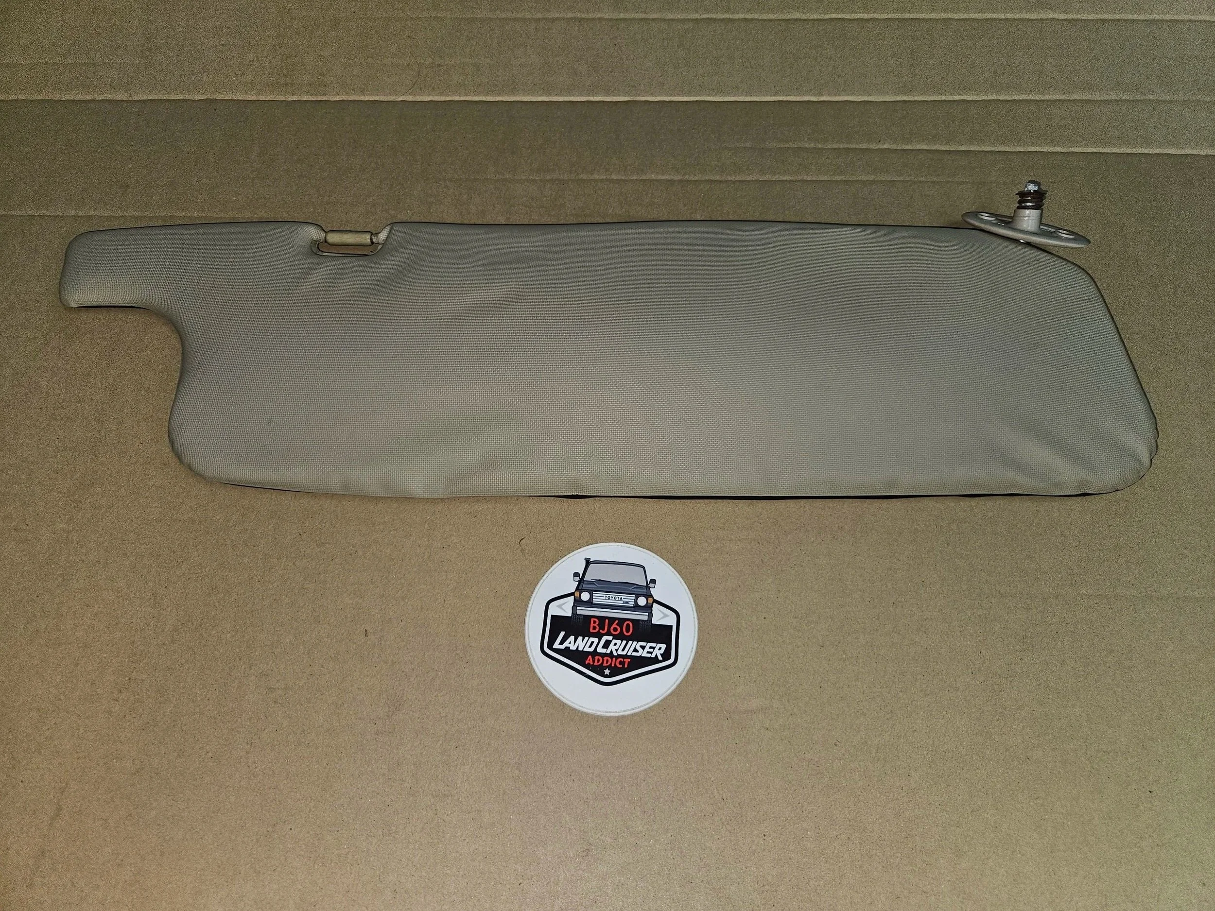 60-series Toyota Landcruiser driver's side ivory visor.