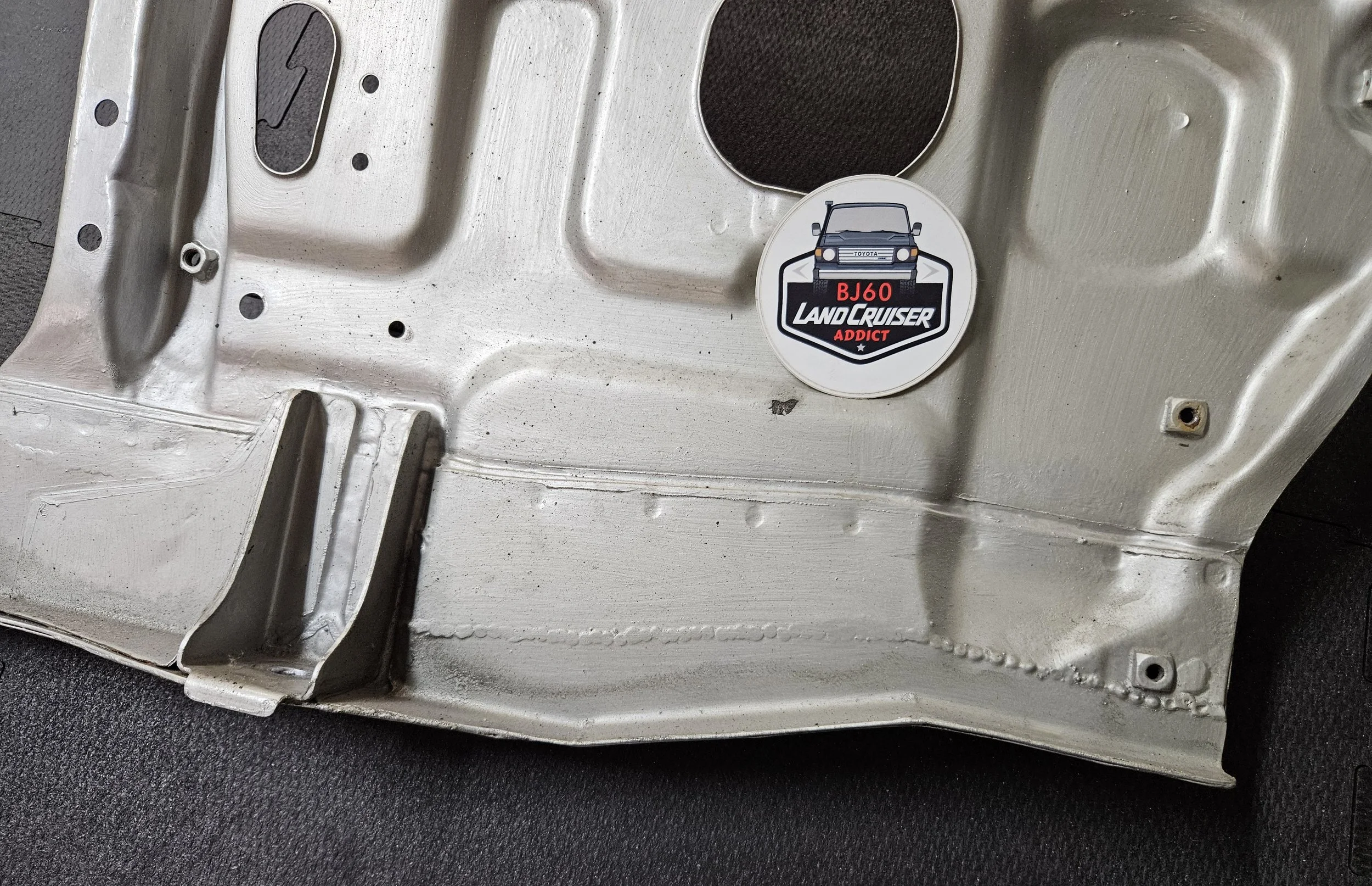 60-series Toyota Landcruiser front core/radiator support, close-up of repair.