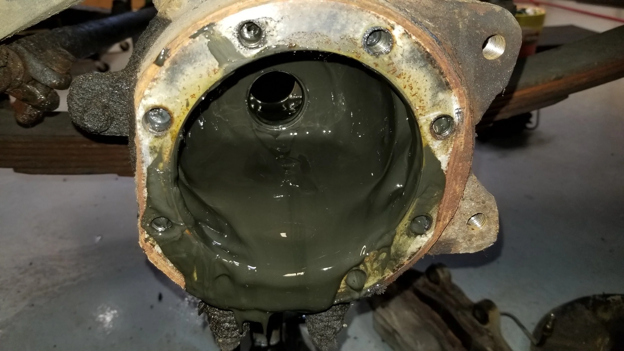 Grease oozing out of a knuckle because of a bad inner axle seal on a 60-series Toyota Landcruiser.