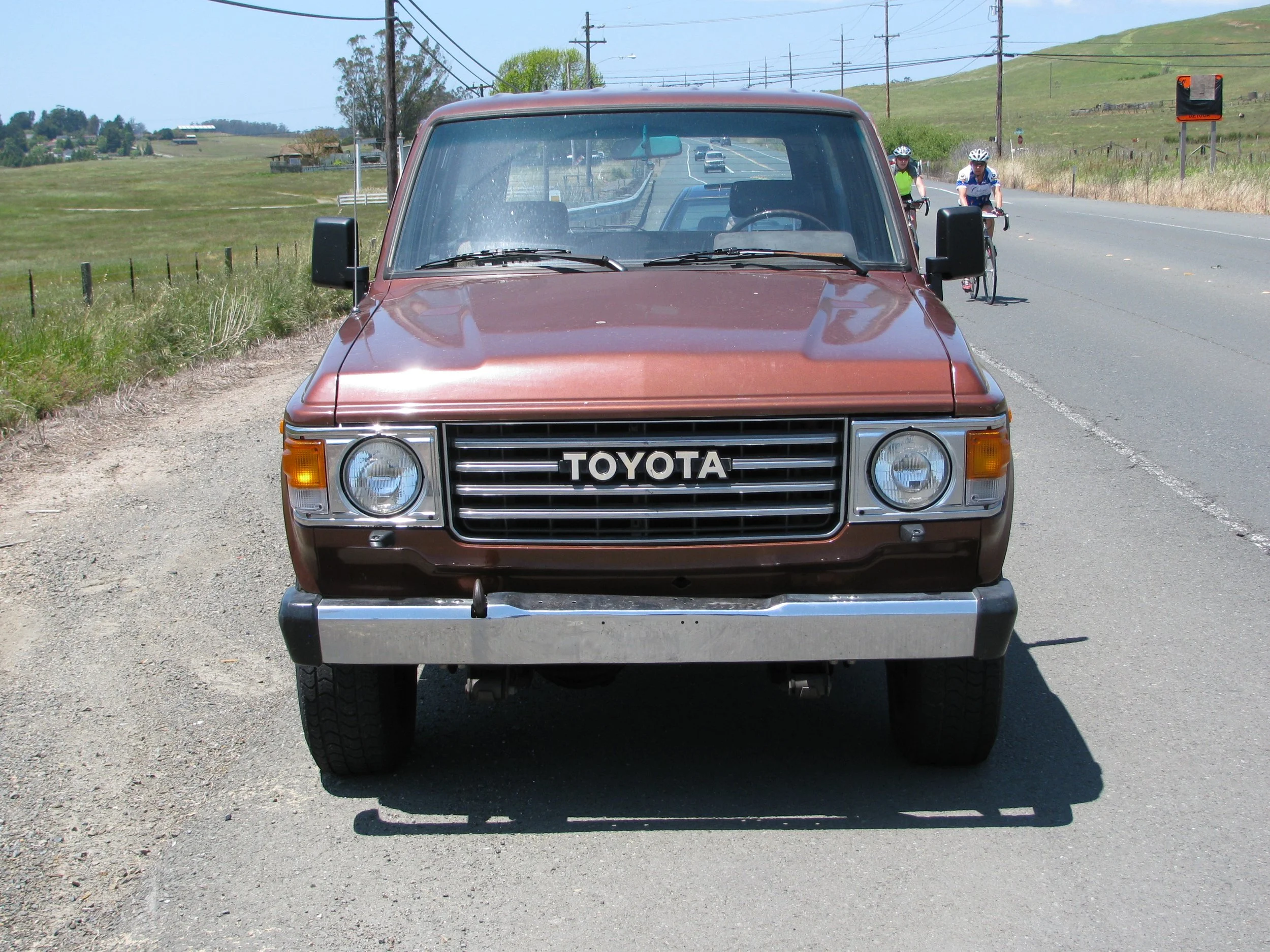 FJ60 Toyota Landcruiser parked on the shoulder during a rest-stop in California.