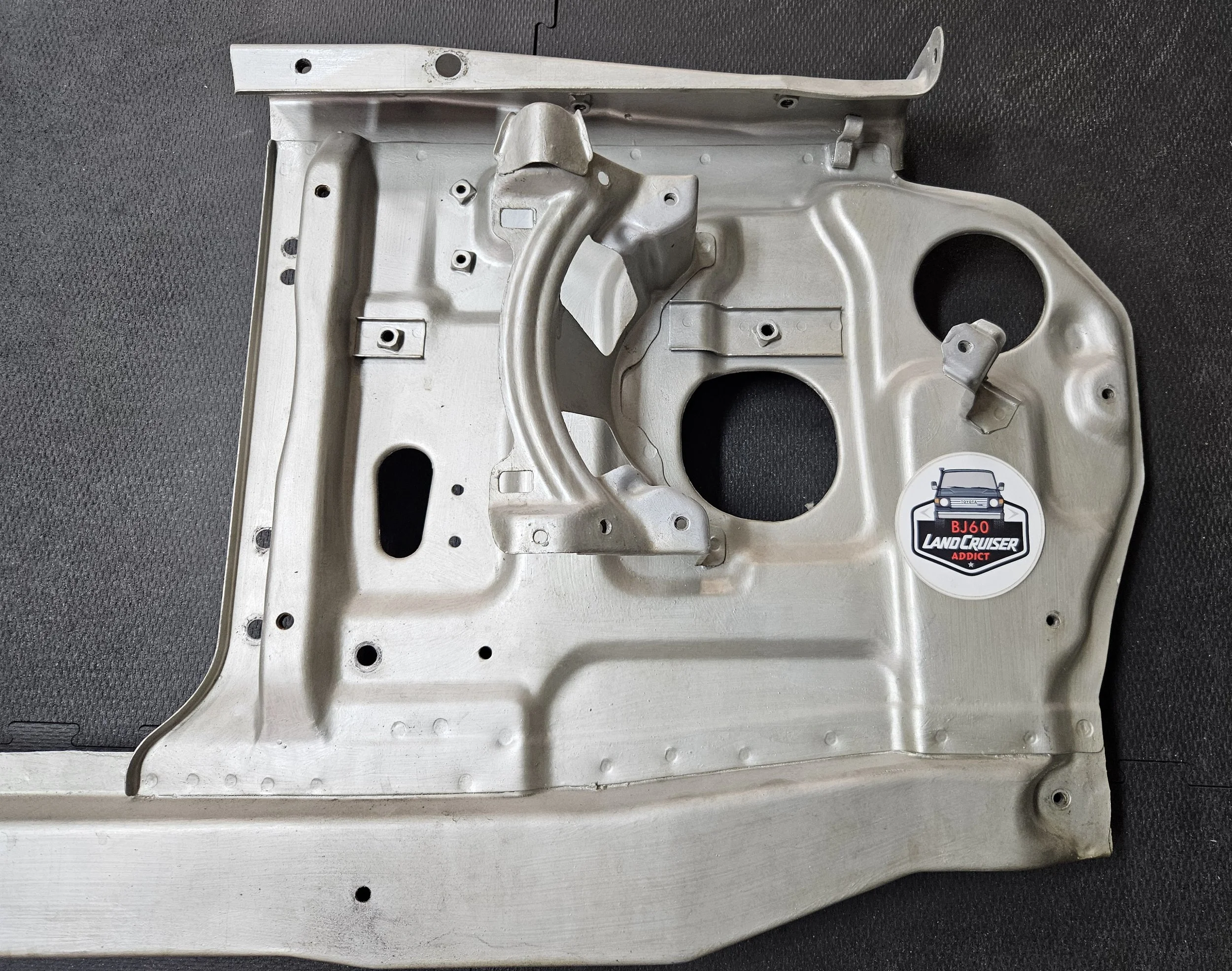 60-series Toyota Landcruiser front core/radiator support, close-up of repair.