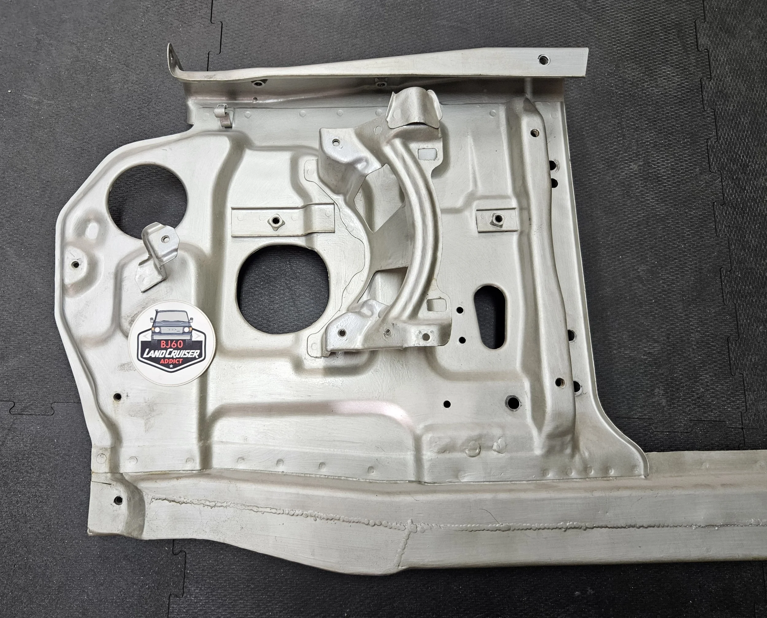 60-series Toyota Landcruiser front core/radiator support, close-up of repair.