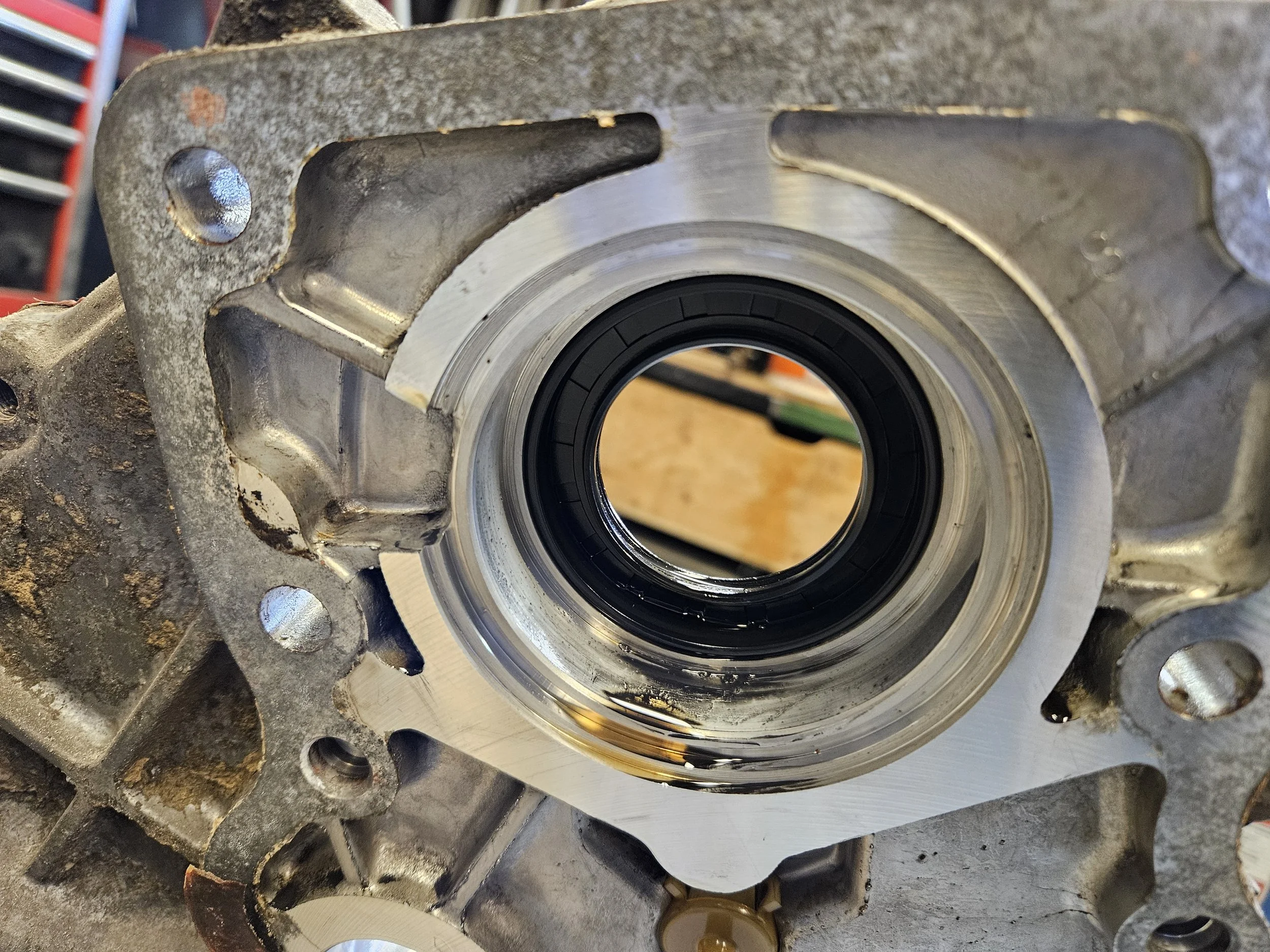 Oil seal between the transmission and transfer case on an H55f Toyota transmission.