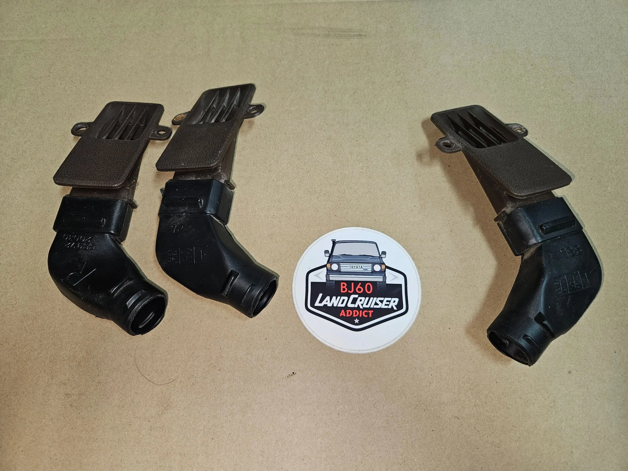 60-series Toyota Landcruiser side window defrost vent and nozzle.