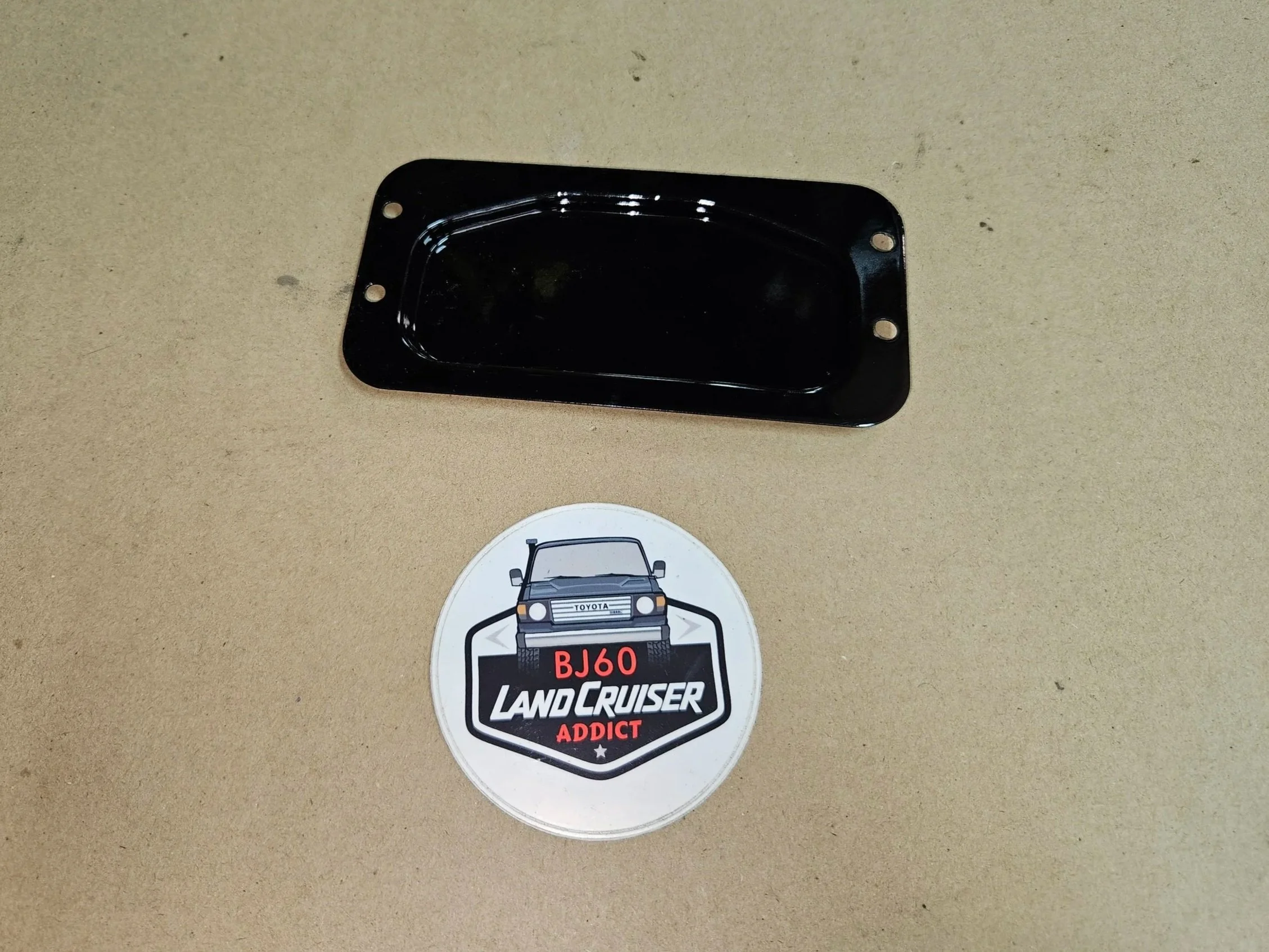 60-series Toyota Landcruiser wiper service cover plate.