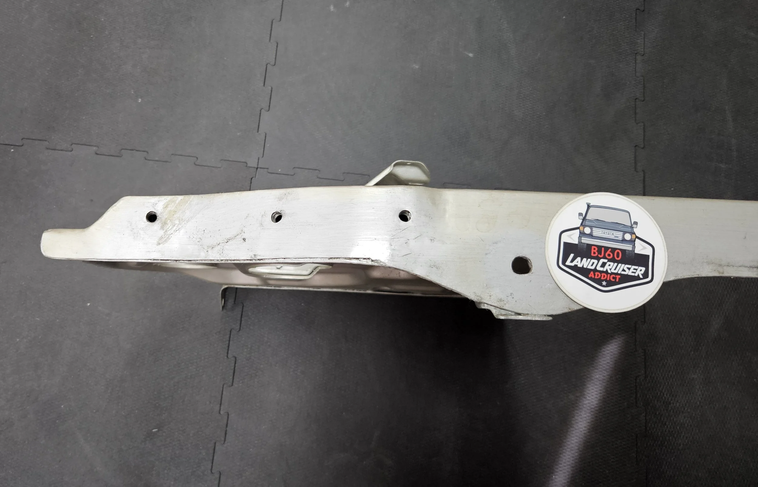 60-series Toyota Landcruiser front core/radiator support, close-up of repair.