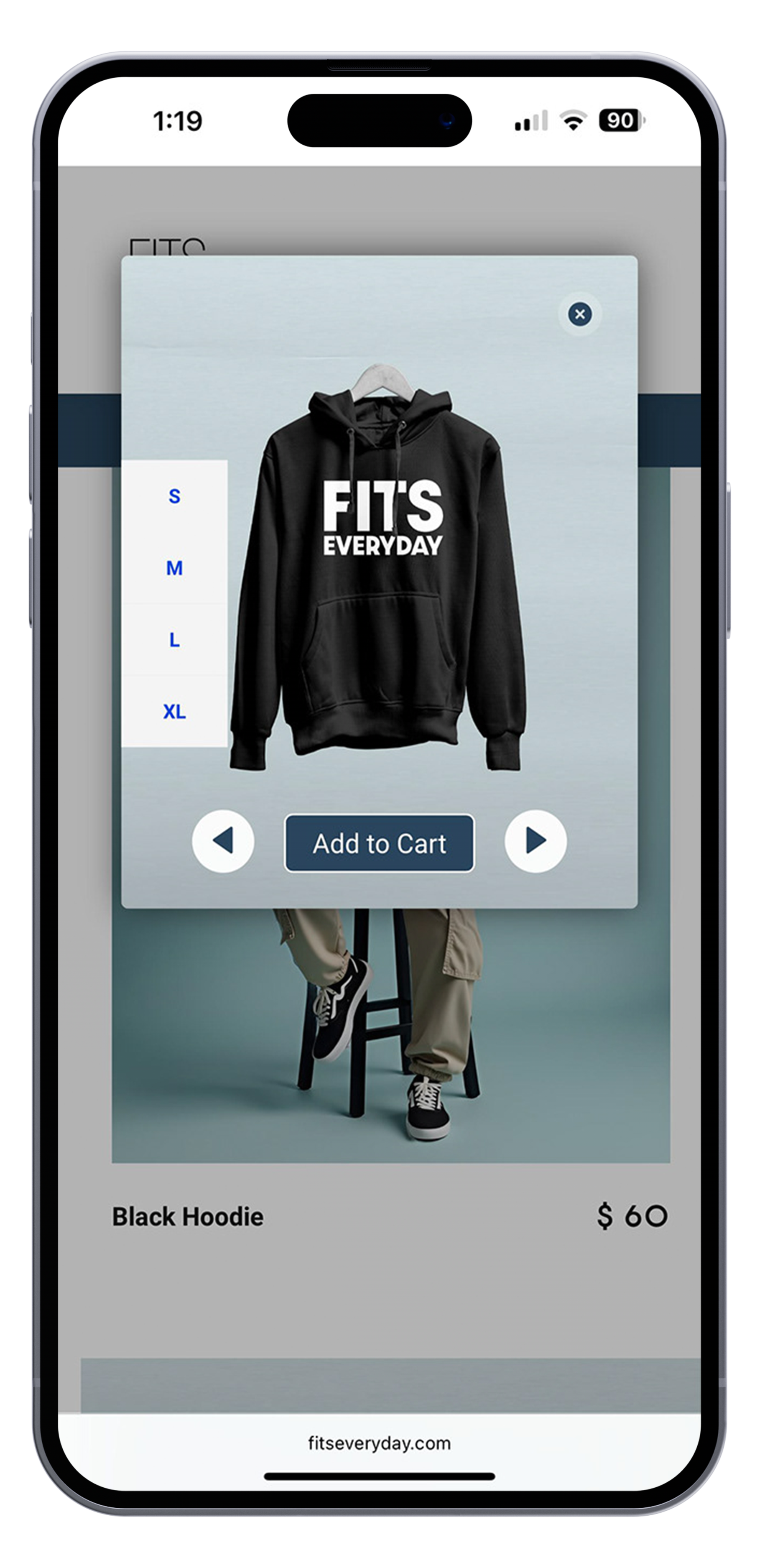 A smartphone screen displaying an online shopping app with a black hoodie featuring the text "FIT'S EVERYDAY" in white, size options listed on the left, a photo of a person wearing beige pants and black sneakers in the background, and an "Add to Cart" button below the hoodie.