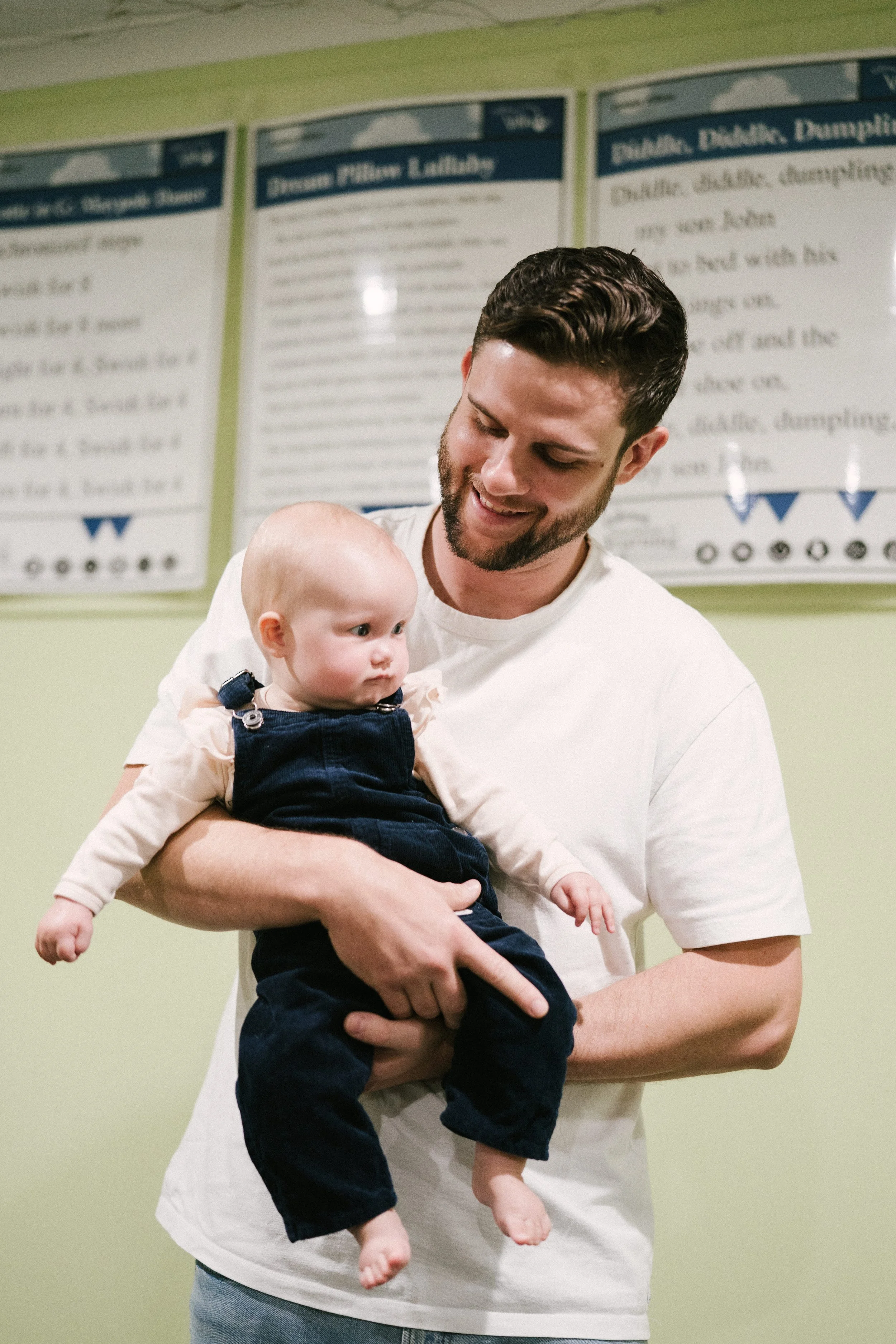 Father bonding, engaging and playing with his baby during a music and movement class at Leisa's Music Place, Toowoomba.