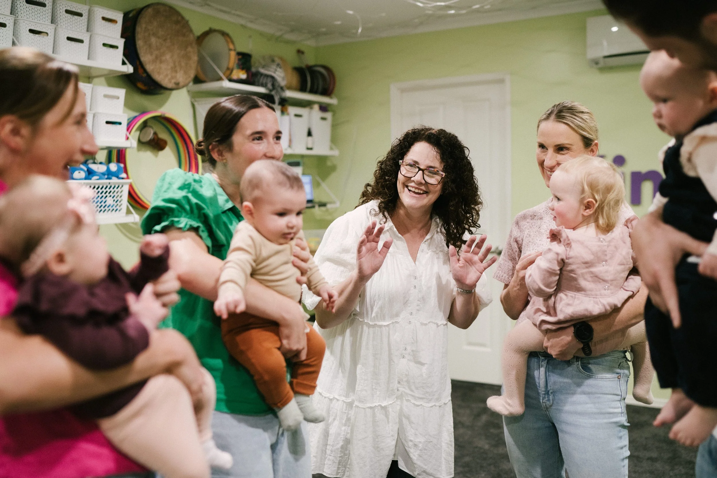 	
Mothers bonding, engaging and playing with their babies during a music and movement class at Leisa's Music Place, Toowoomba.