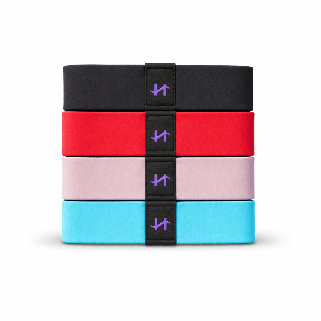 Picture of haut-ties stacked showing black, red, pink and blue color palates from top to bottom