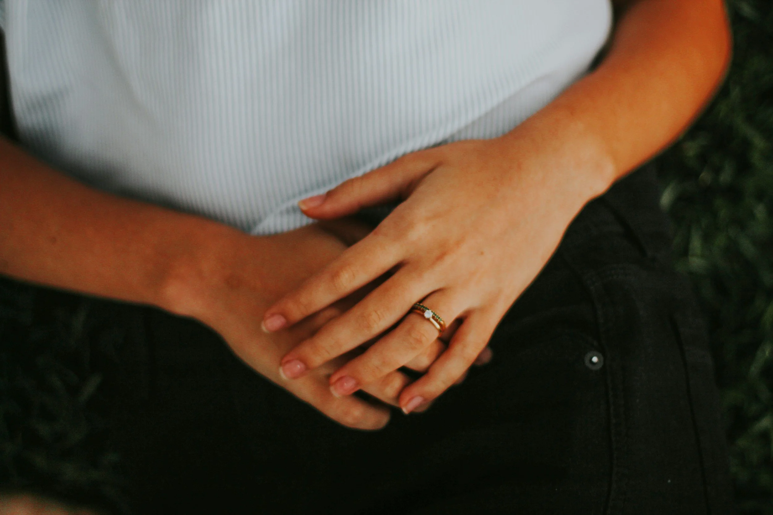 person holding abdomen showing bloating discomfort