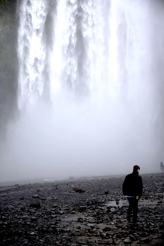 Richard Fidler at waterfall in the south of Iceland. Photo by Kari Gislason.