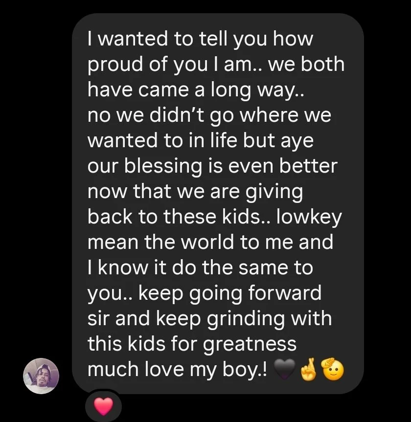 A heartfelt message of pride and encouragement about parenthood and perseverance, with emojis of a black heart, finger pointing up, smiling face, and a pink heart.