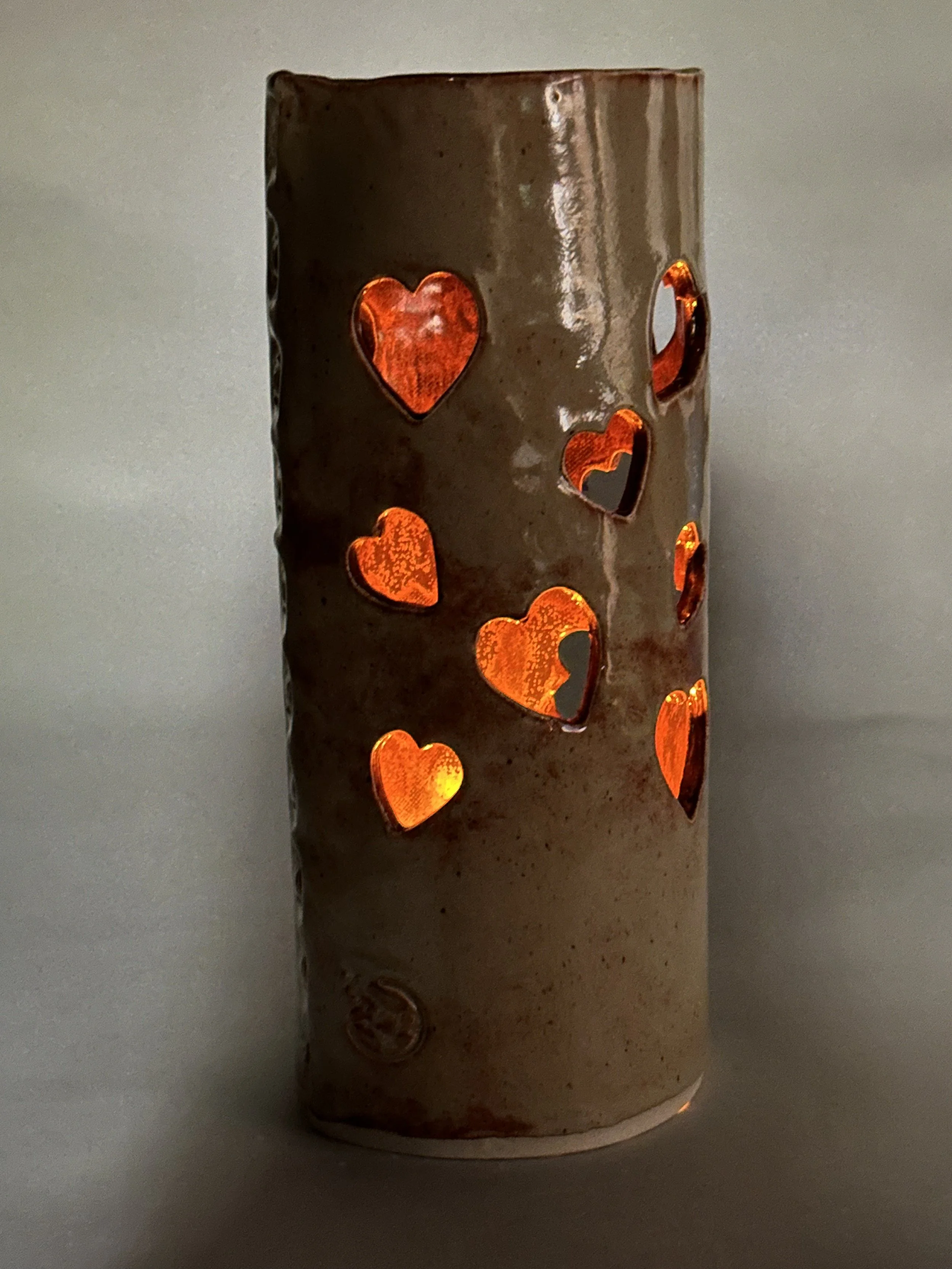 This lantern shimmers with a copper‑glazed interior, while the Shino exterior reflects a soft, natural warmth. A cozy accent for a deck, patio, or tucked beside the fireplace.