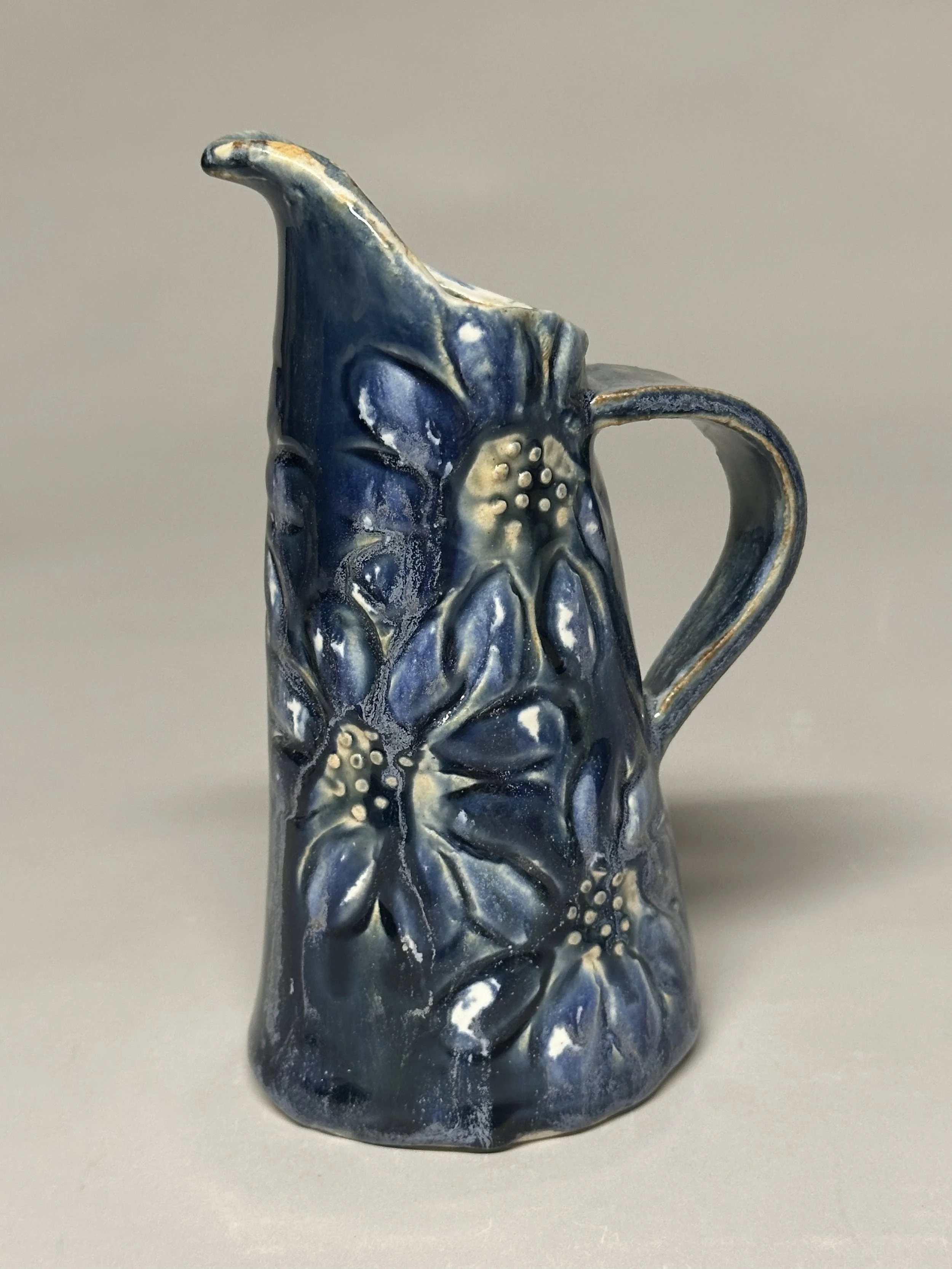 This cute little daisy pitcher is glazed with Ash Blue and a combination of eight layered glazes, finished with handmade stamps for extra texture and charm. SOLD!