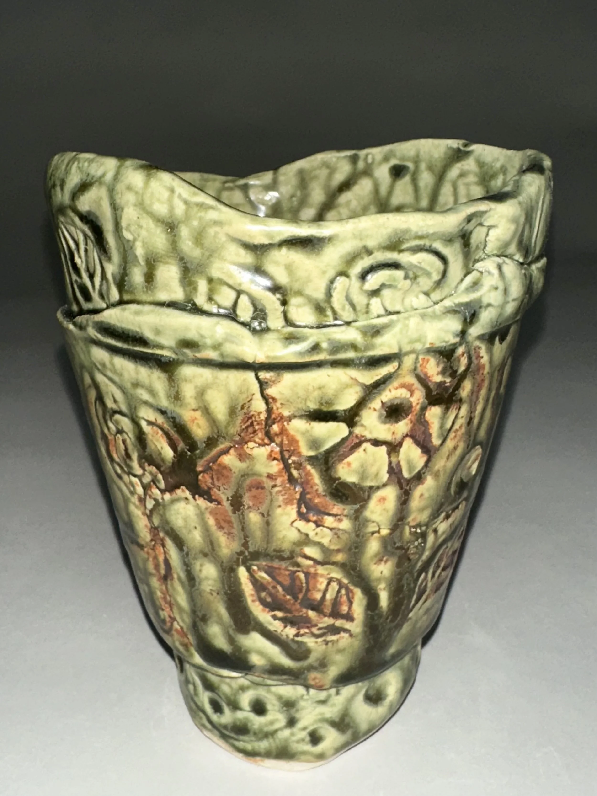 Handcrafted with a layered porcelain clay technique, this flower pot features surface textures achieved using mostly handmade stamps and a rich glaze that highlights every botanical impression. It’s the perfect vessel for your favorite plants and a b